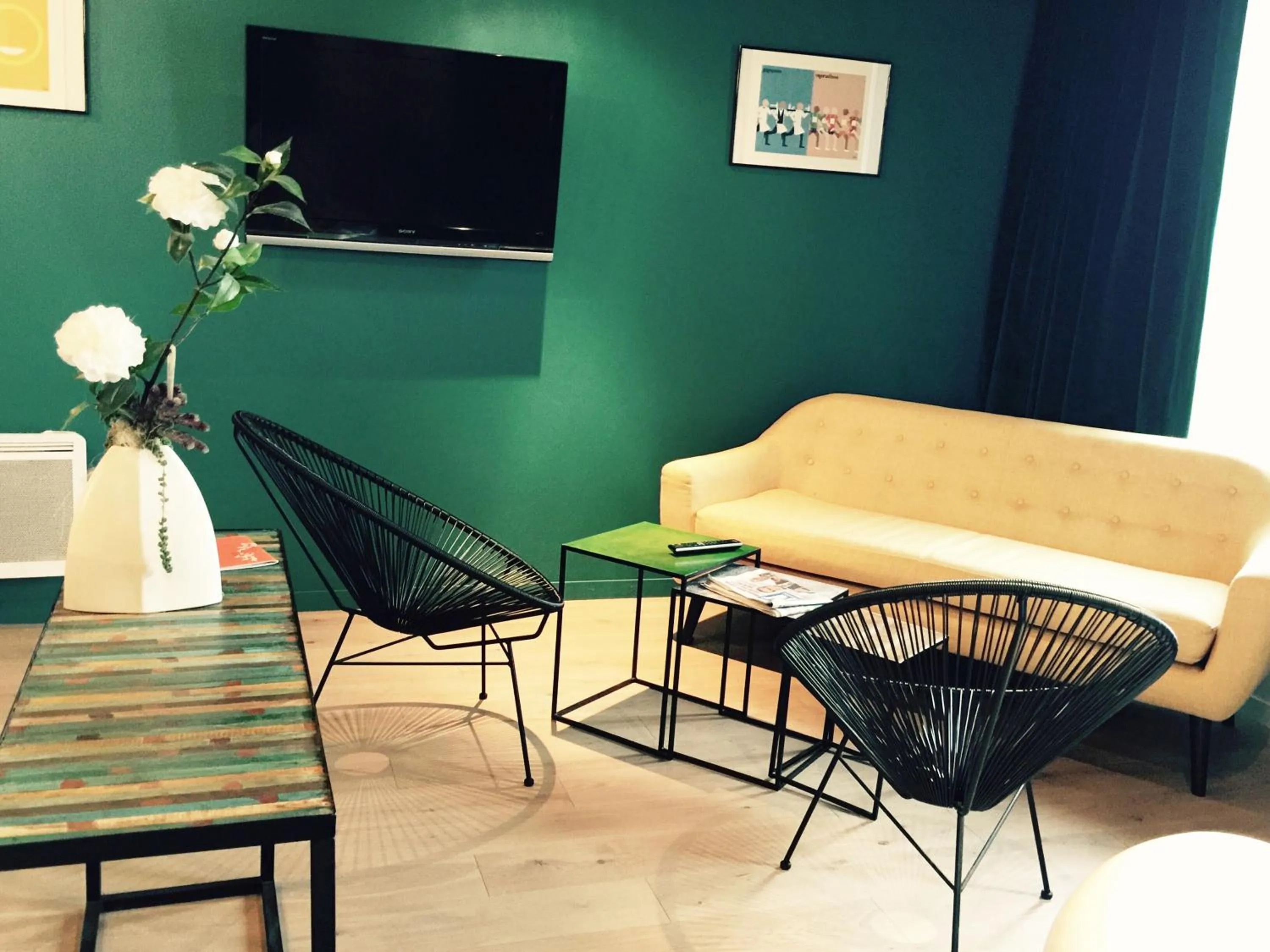 Communal lounge/ TV room in The Originals Boutique, Hôtel La Villa Marine, Le Tréport