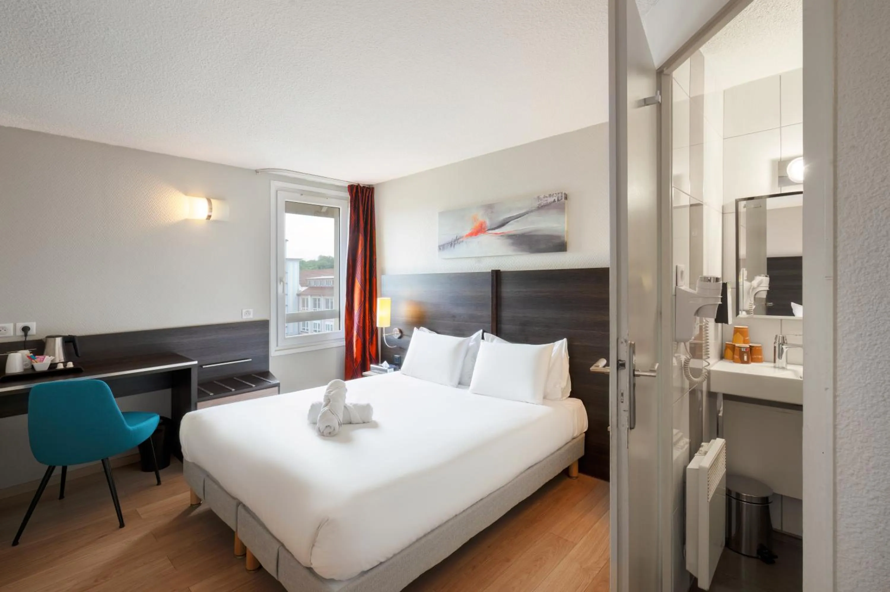 Photo of the whole room, Bed in Kyriad Belfort Centre Gare