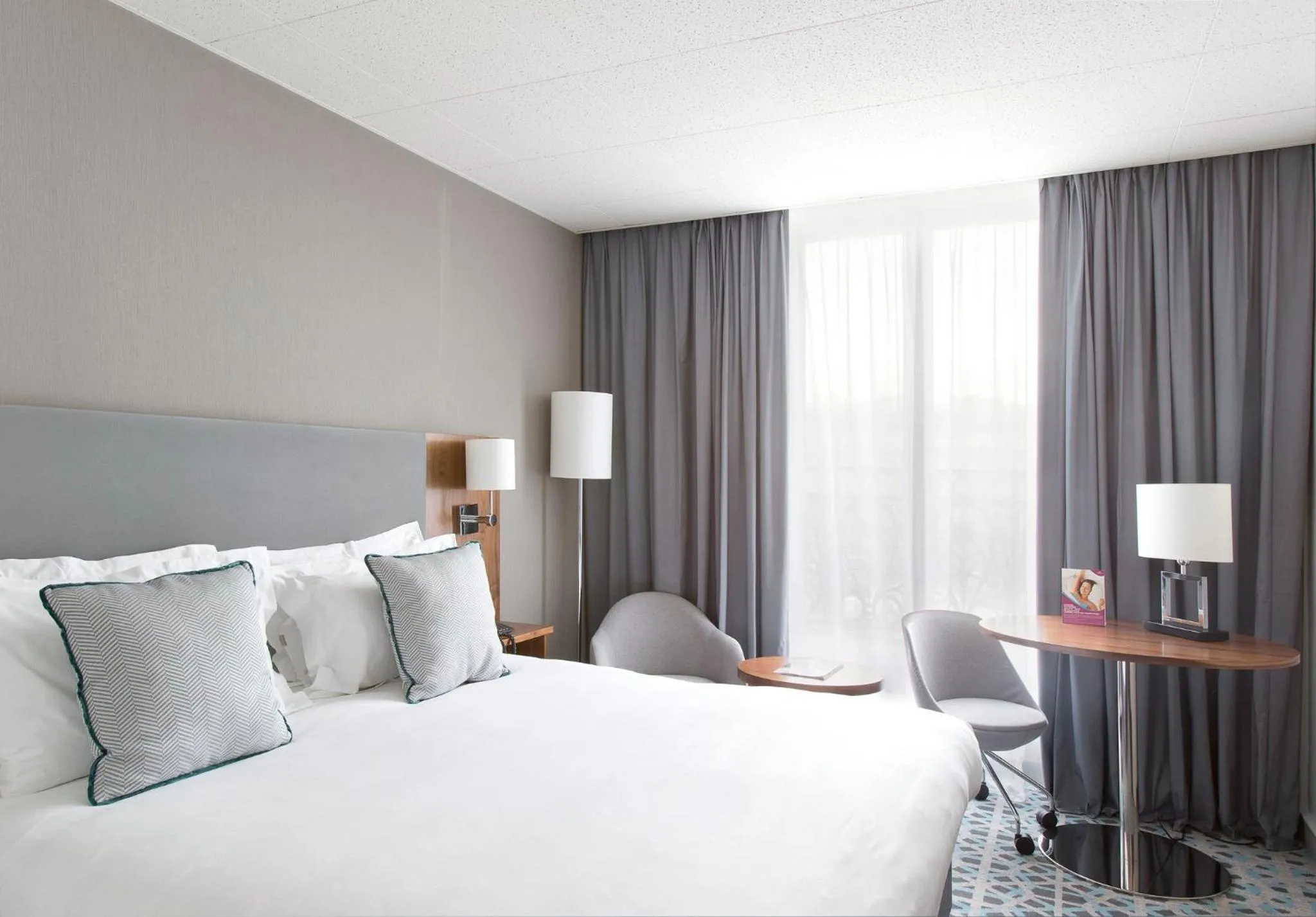 Photo of the whole room, Bed in Crowne Plaza Paris - Republique by IHG