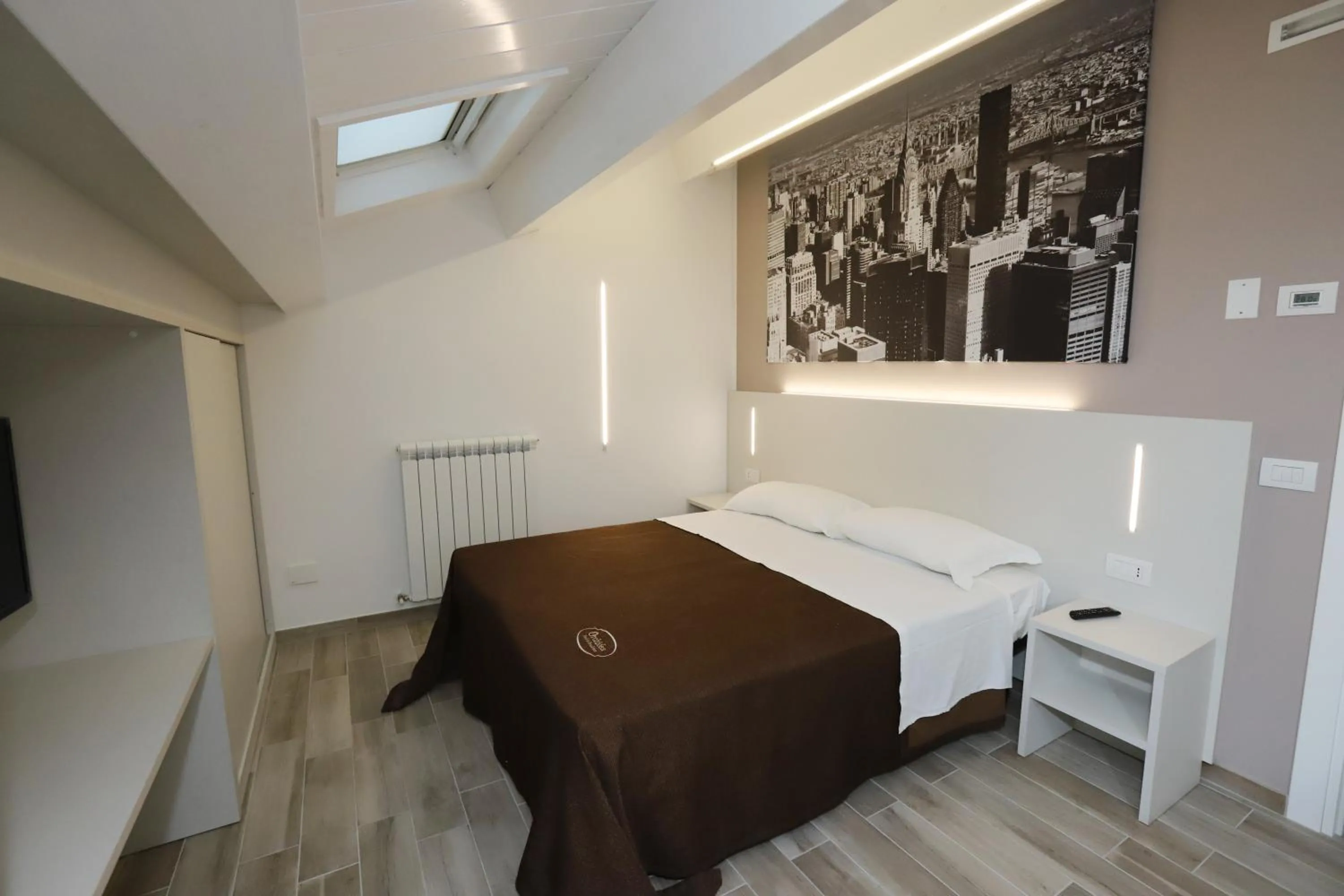 Bed in Orchidea Rooms & Suites