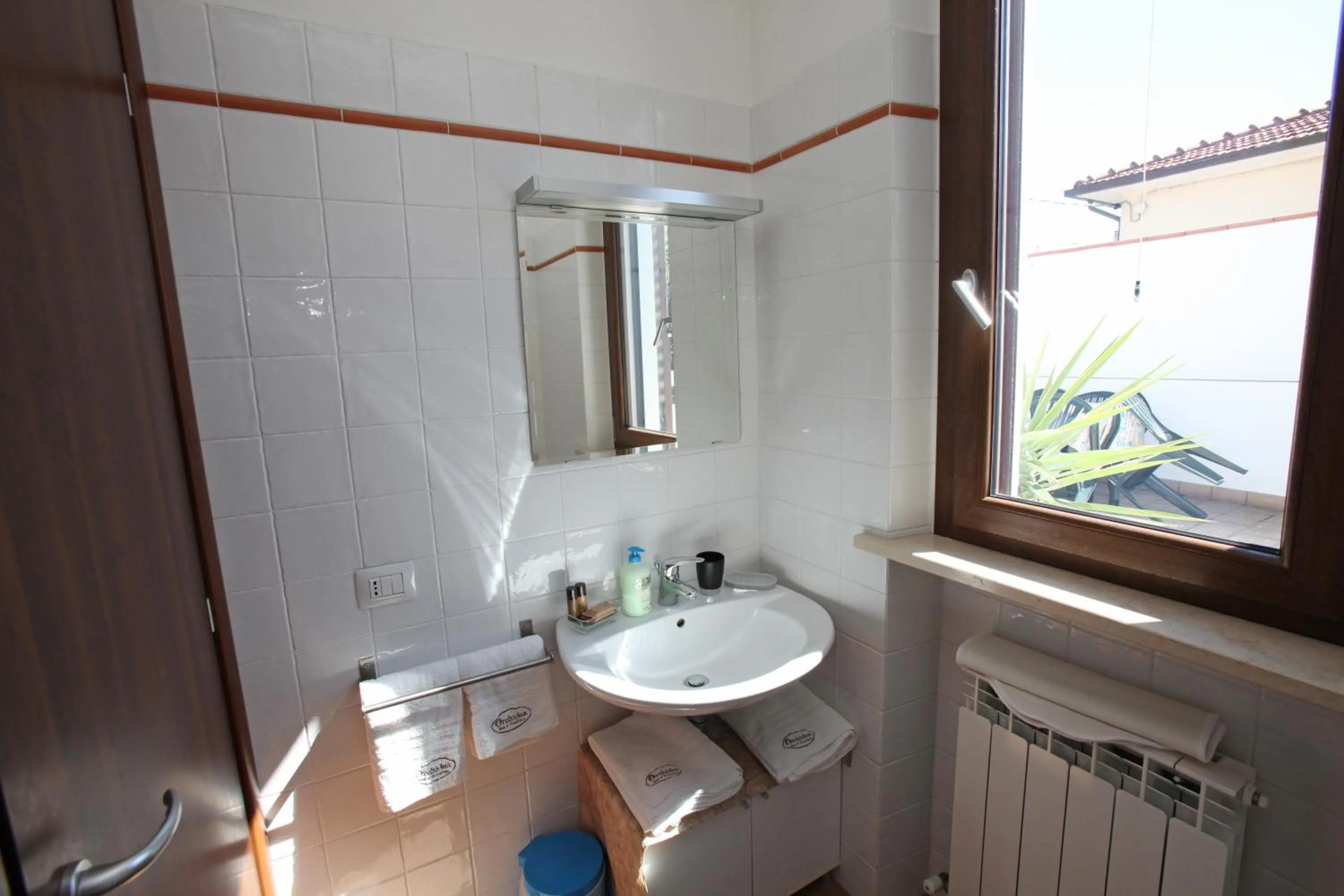 Bathroom in Orchidea Rooms & Suites