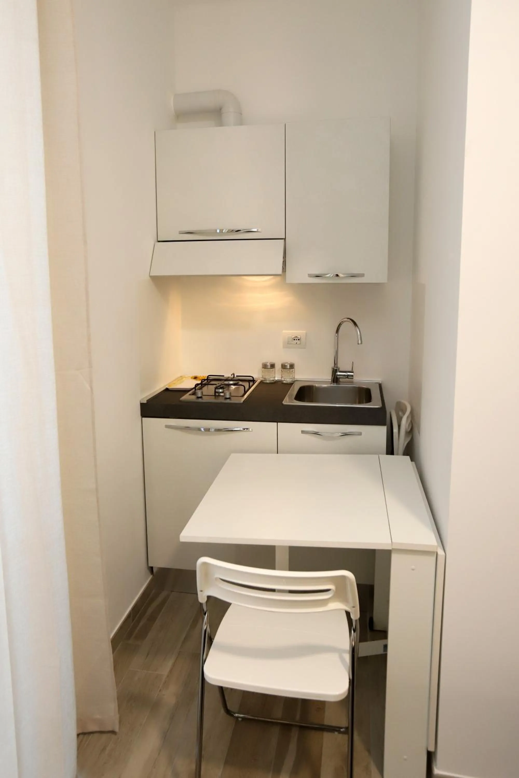 Kitchen or kitchenette in Orchidea Rooms & Suites