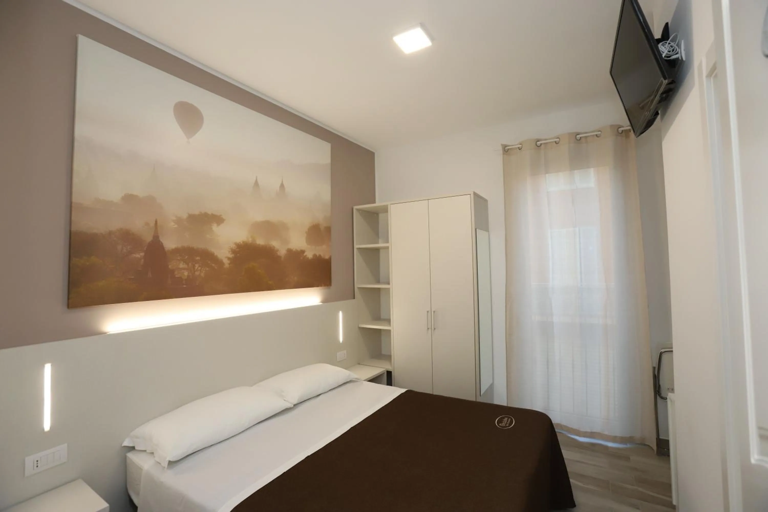 Bed in Orchidea Rooms & Suites