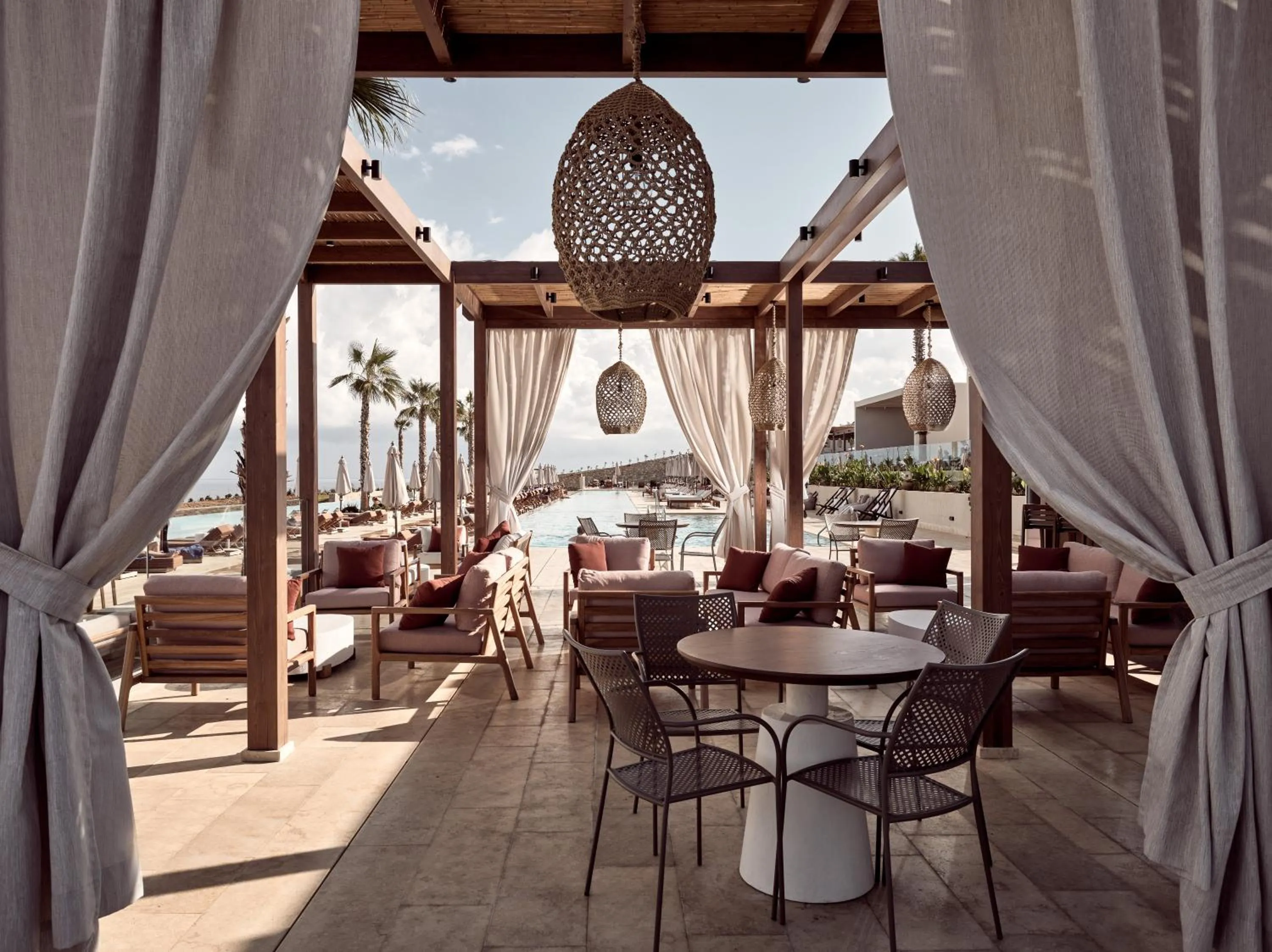 Lounge or bar in The Royal Senses Resort & Spa Crete, Curio Collection by Hilton