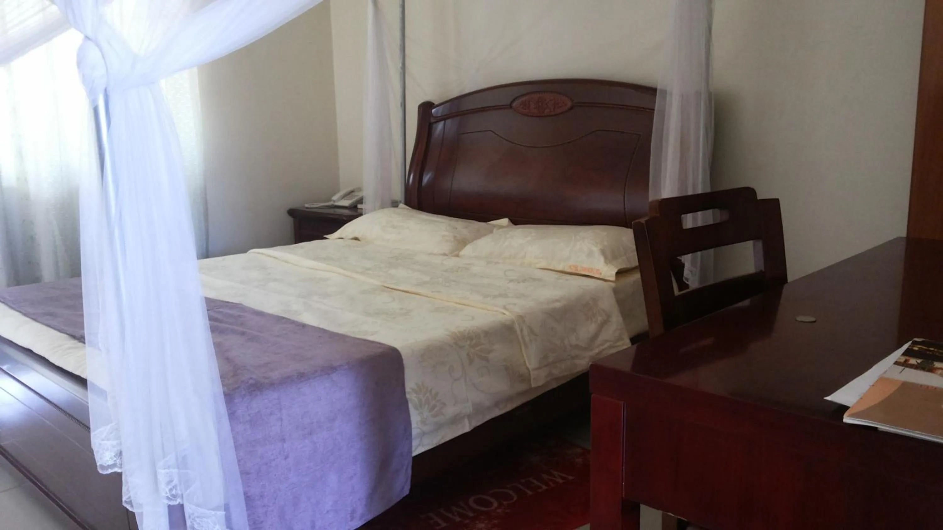Bedroom in Zawadi Hotel