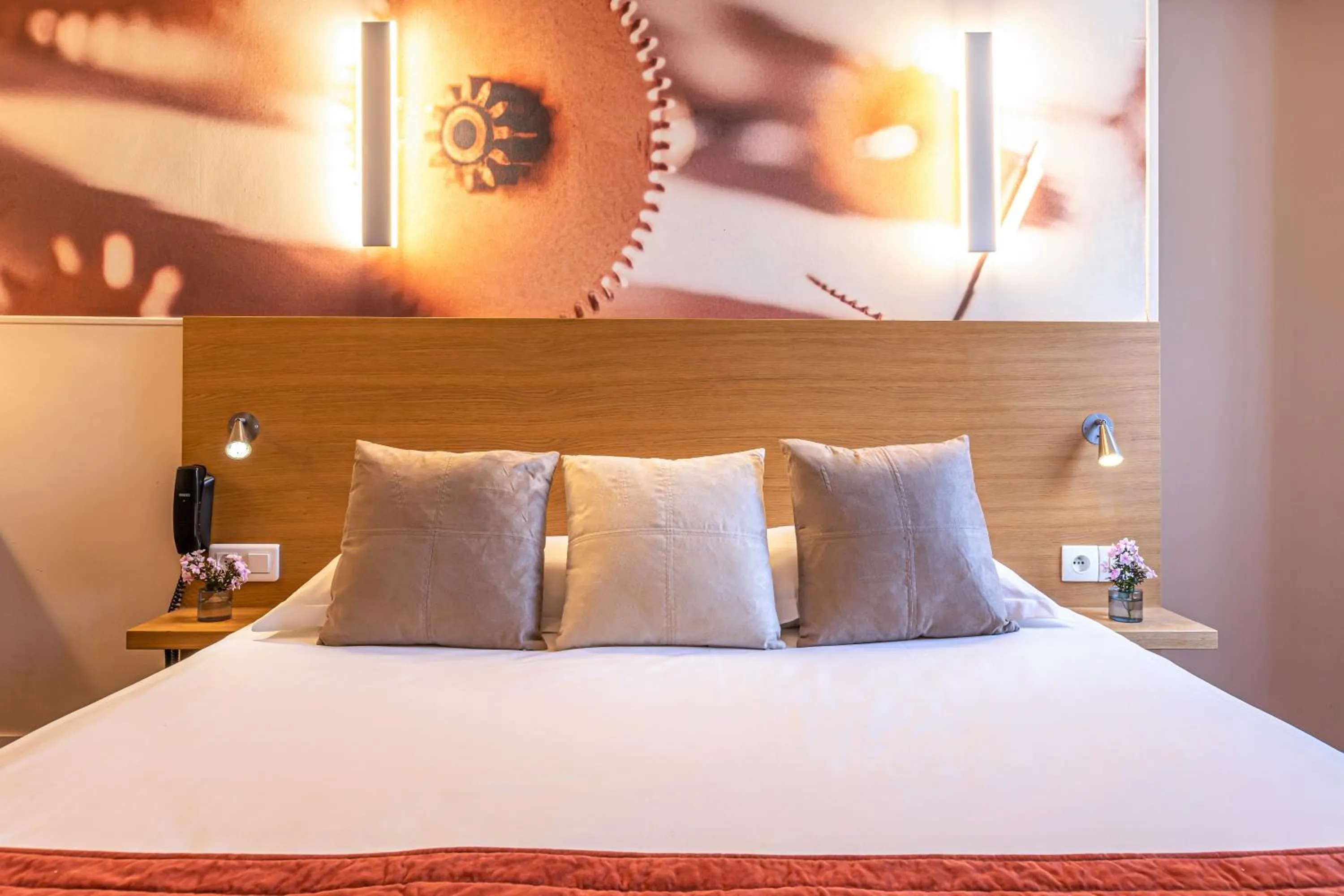 Bed in Hotel Ariane Montparnasse by Patrick Hayat