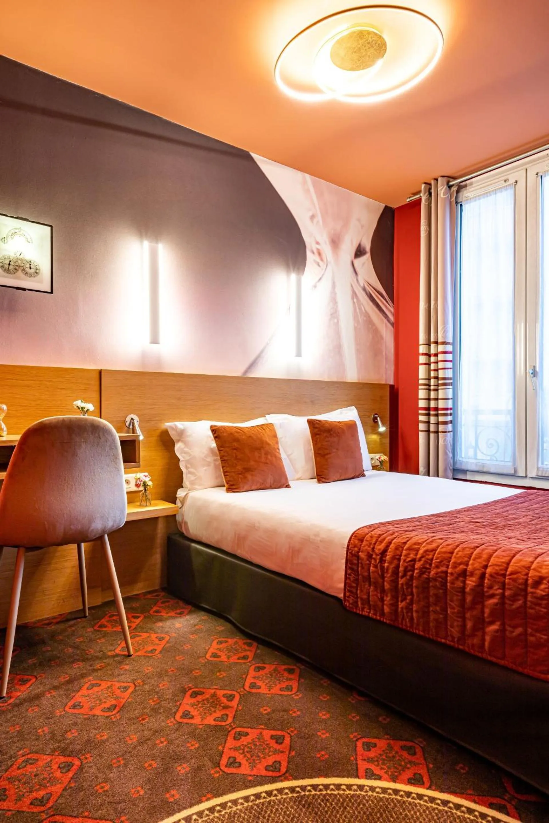 Bed in Hotel Ariane Montparnasse by Patrick Hayat