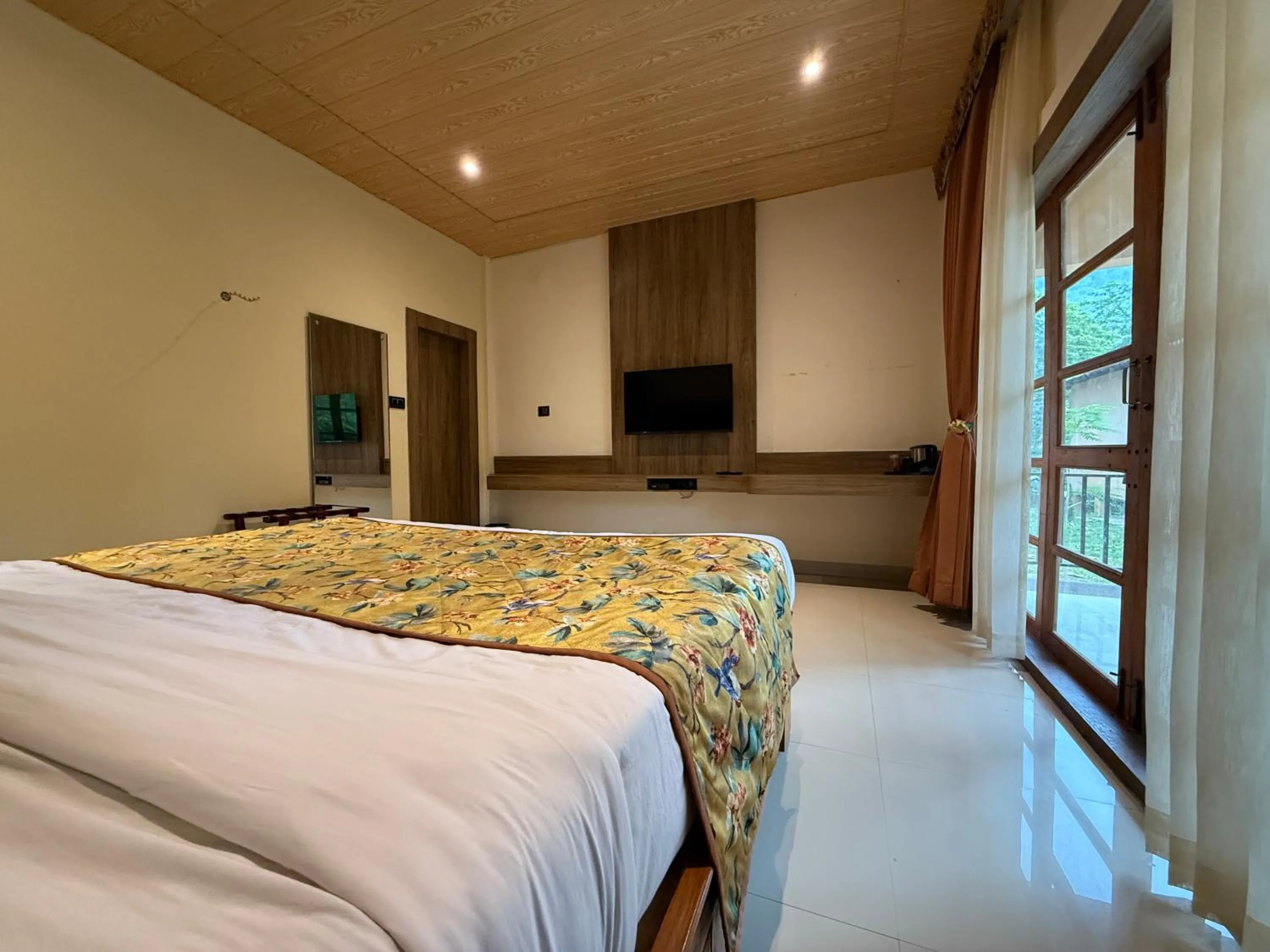 Bed in Kaziranga Eco Village Resort