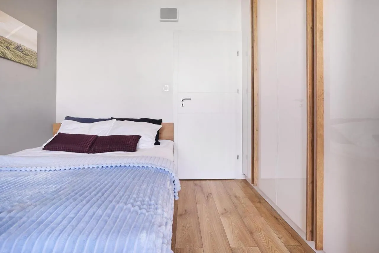 Bed in Symphony Baltica Towers Apartamenty