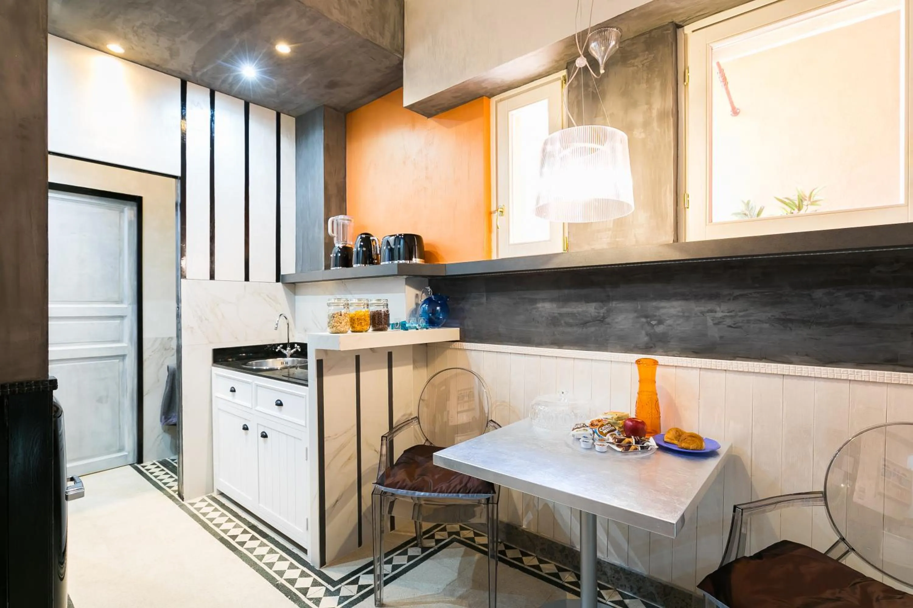 Kitchen or kitchenette in Appartamenti MarcoAurelio49