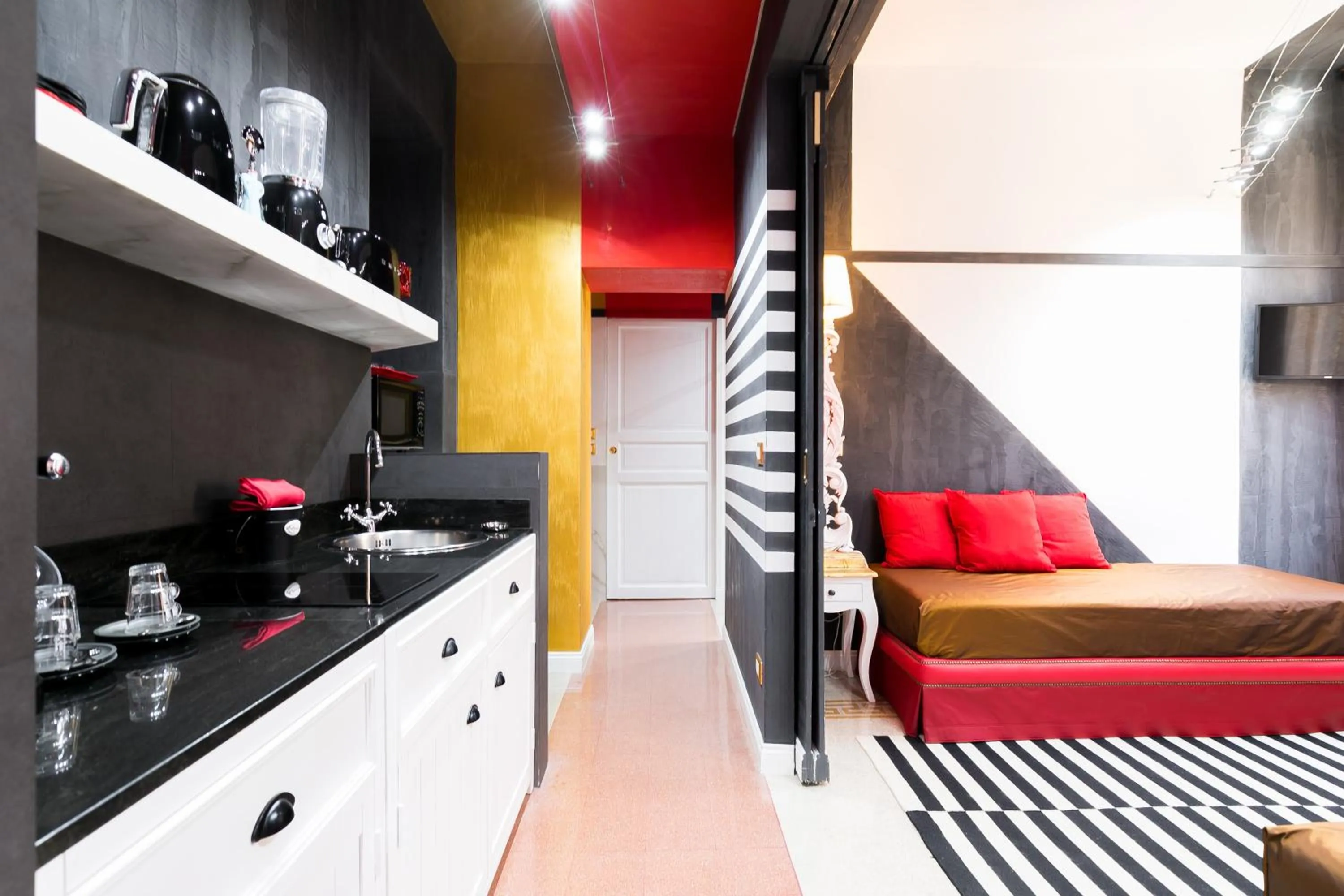 Kitchen or kitchenette in Appartamenti MarcoAurelio49