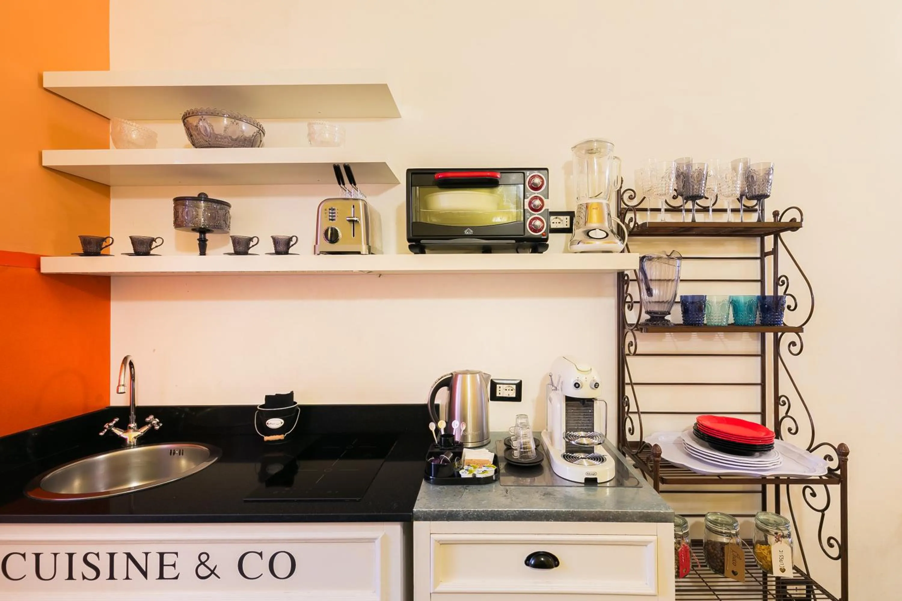 Kitchen or kitchenette in Appartamenti MarcoAurelio49