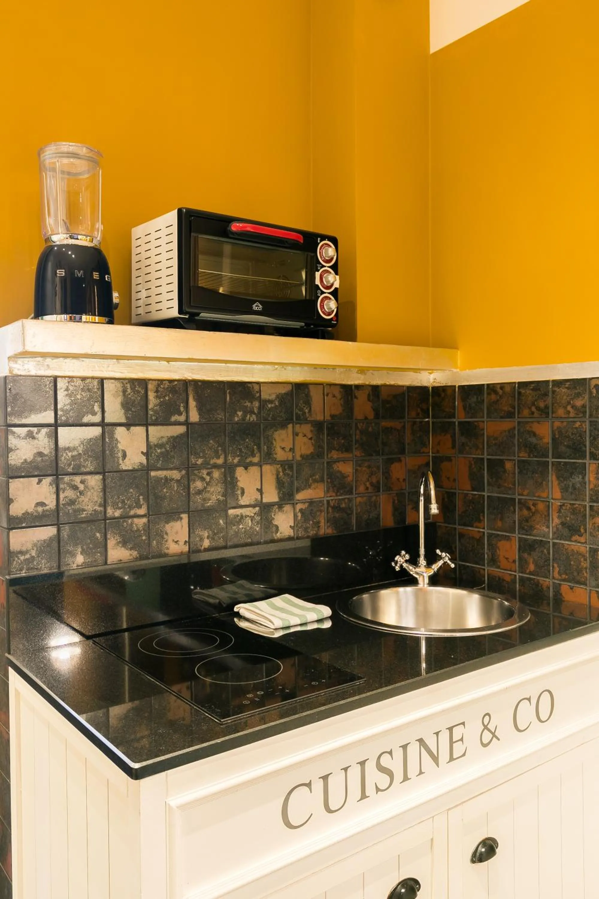 Kitchen or kitchenette in Appartamenti MarcoAurelio49