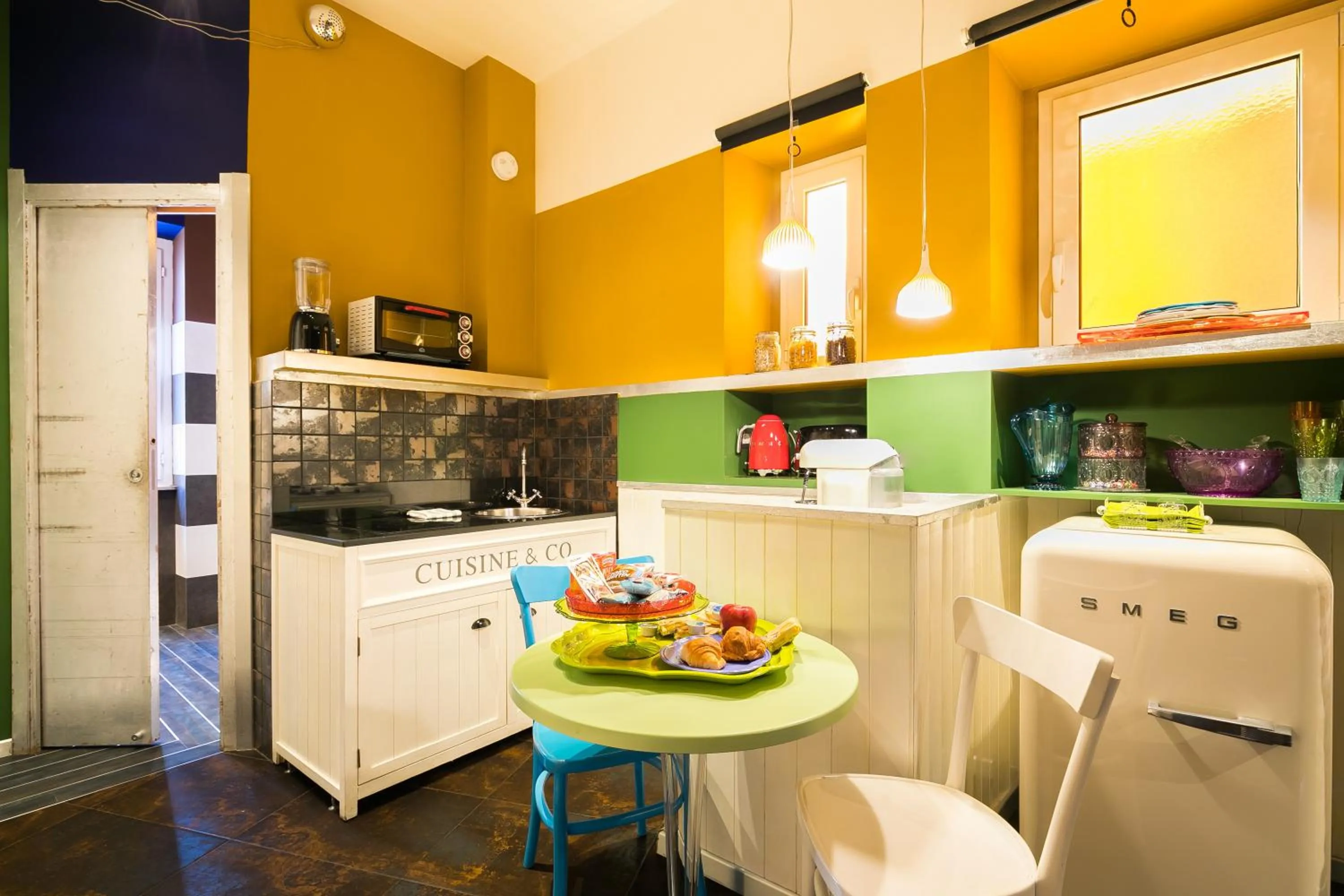 Kitchen or kitchenette in Appartamenti MarcoAurelio49