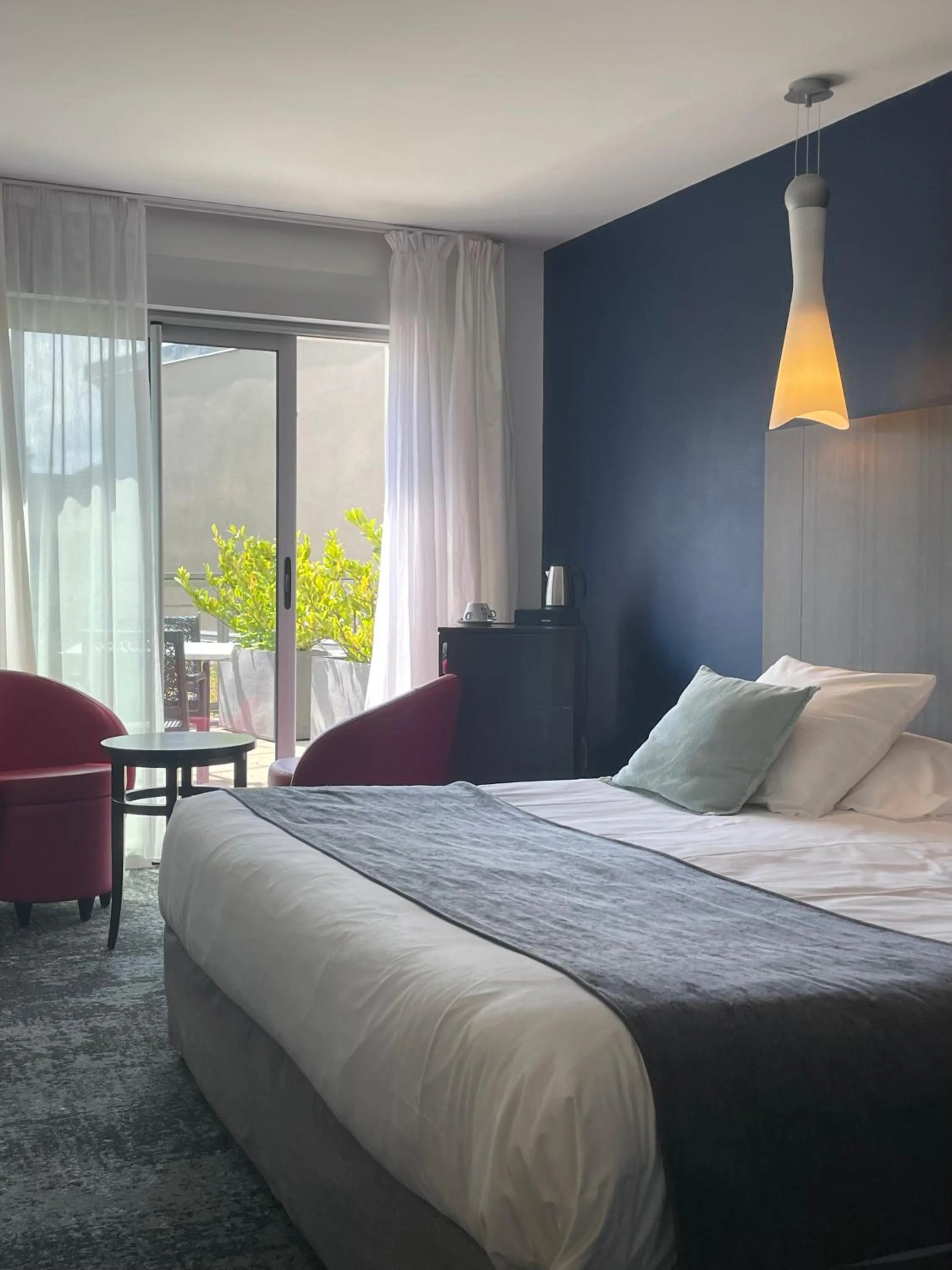 Bedroom, Bed in Logis Hôtel Victor Hugo & Spa