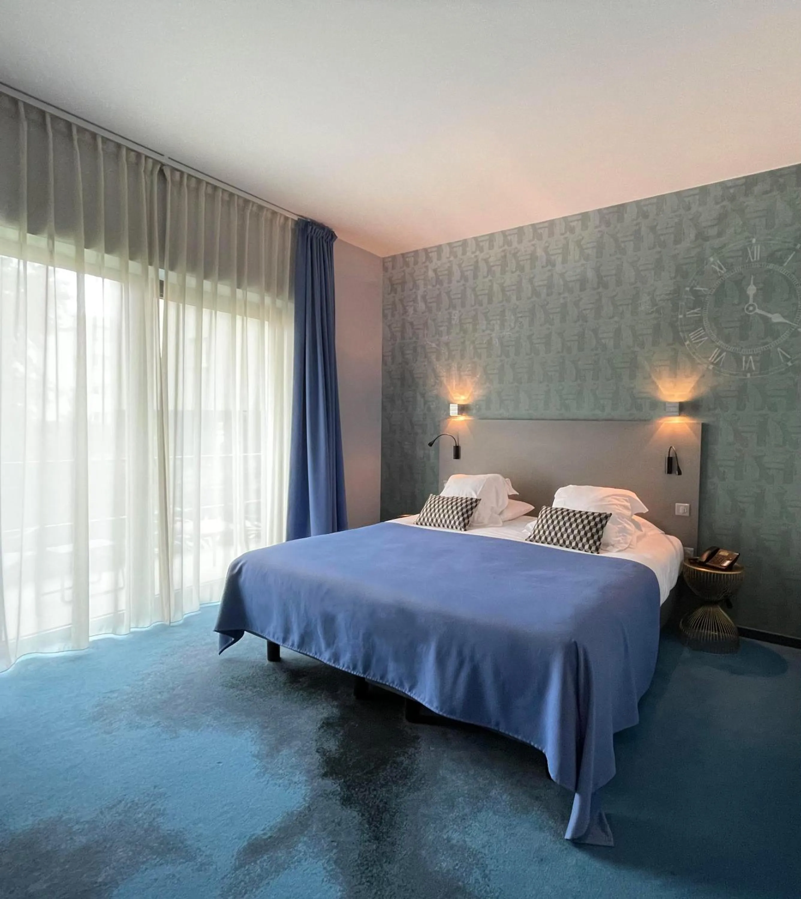Photo of the whole room, Bed in Logis Hôtel Victor Hugo & Spa