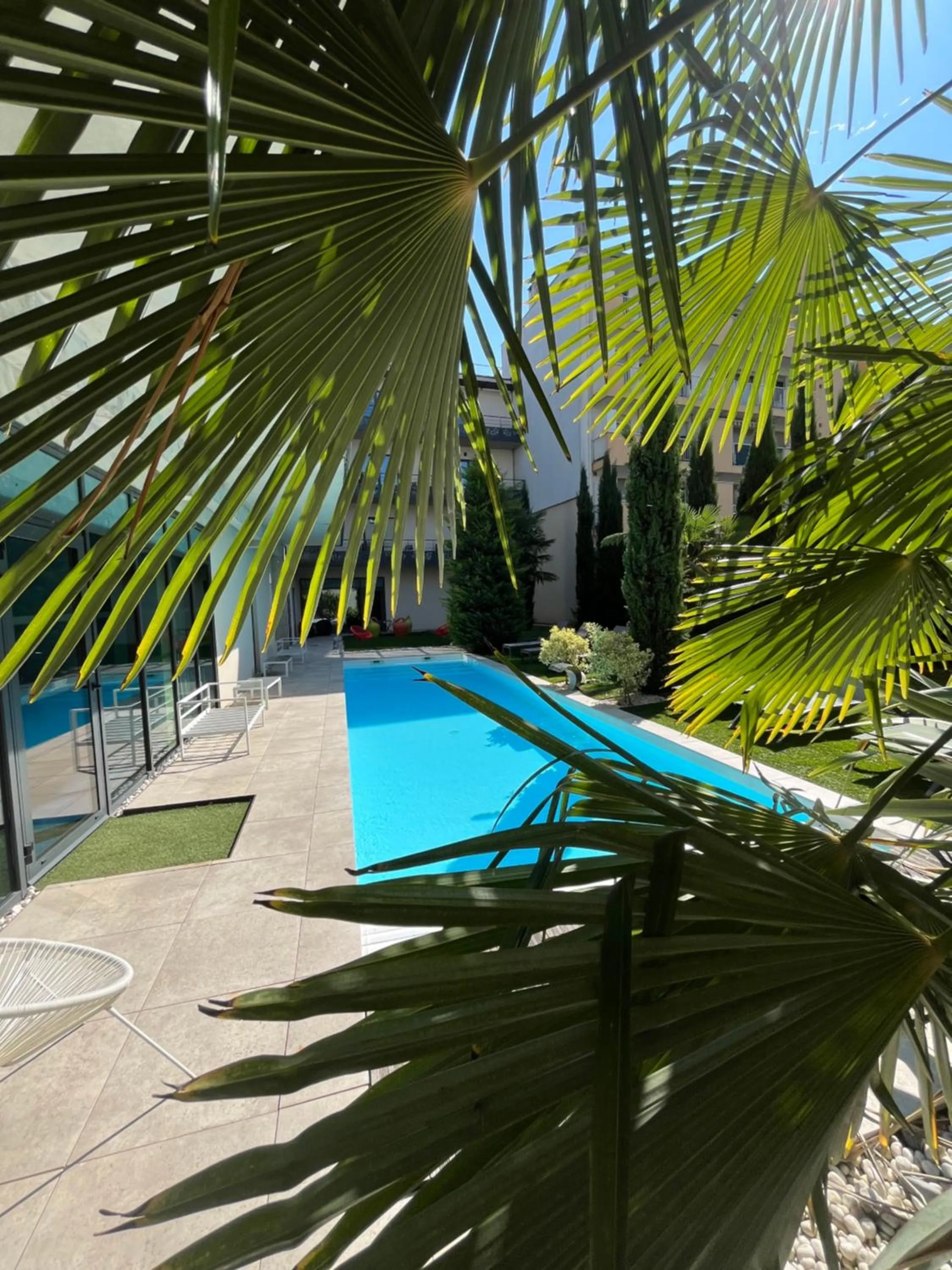 Swimming pool in Logis Hôtel Victor Hugo & Spa