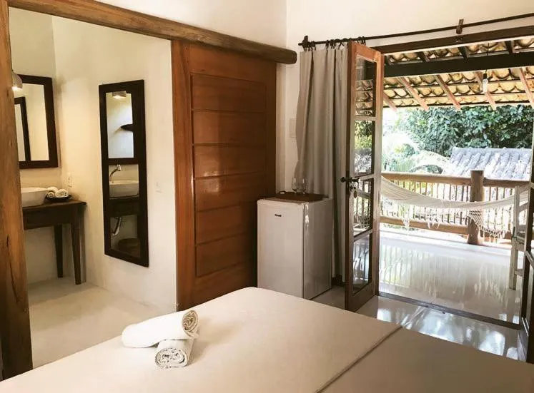 Bed in Pousada Jequitibá