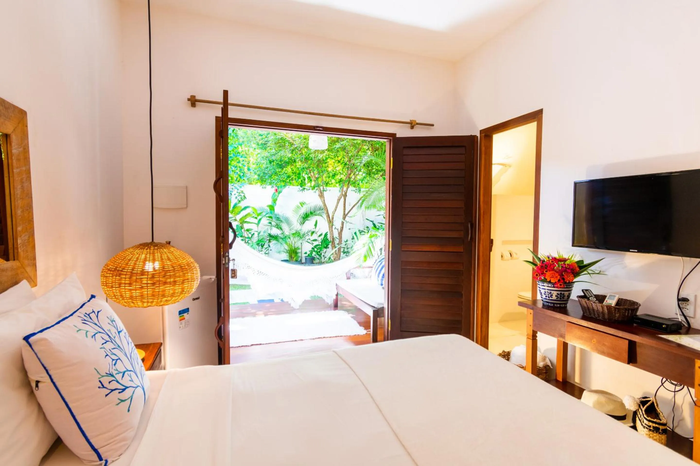 Bed in Pousada Jequitibá