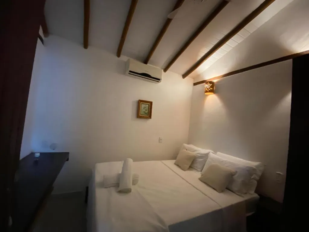 Bed in Pousada Jequitibá