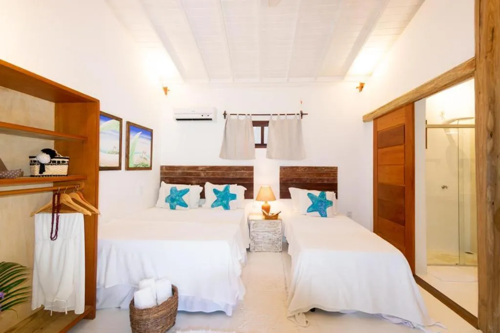 Bed in Pousada Jequitibá