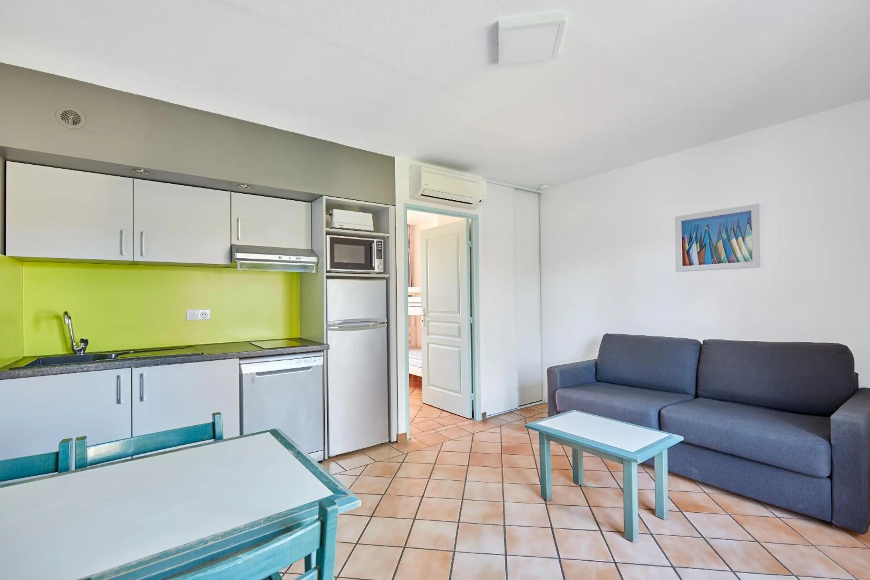 Kitchen or kitchenette in Résidence Odalys La Palmeraie