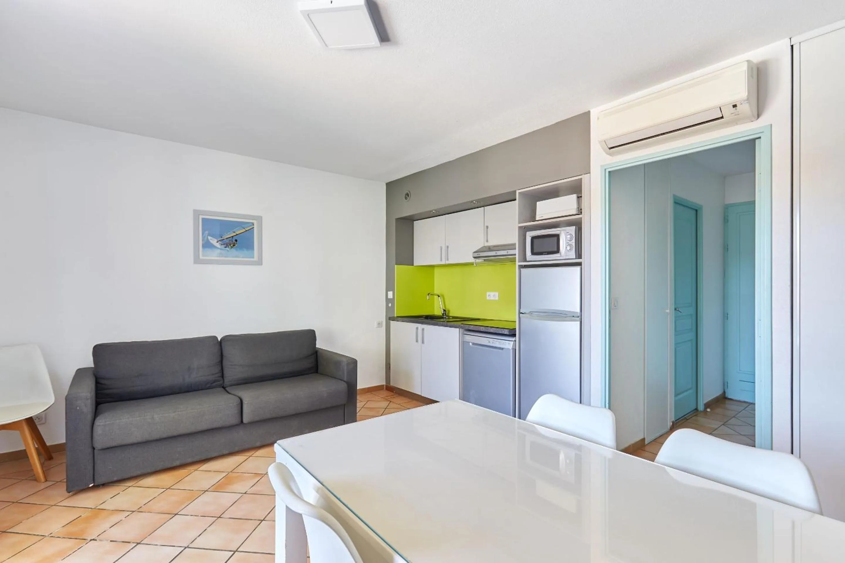 Kitchen or kitchenette in Résidence Odalys La Palmeraie