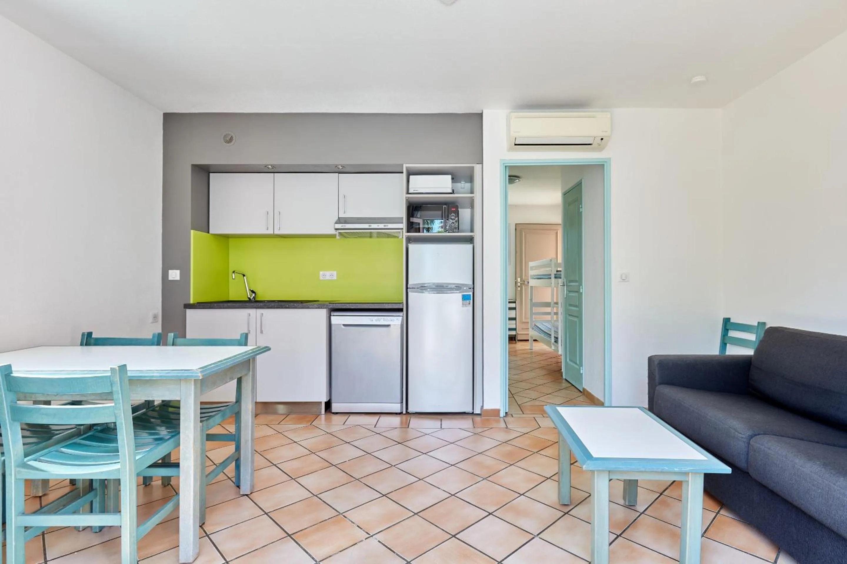 Kitchen or kitchenette in Résidence Odalys La Palmeraie