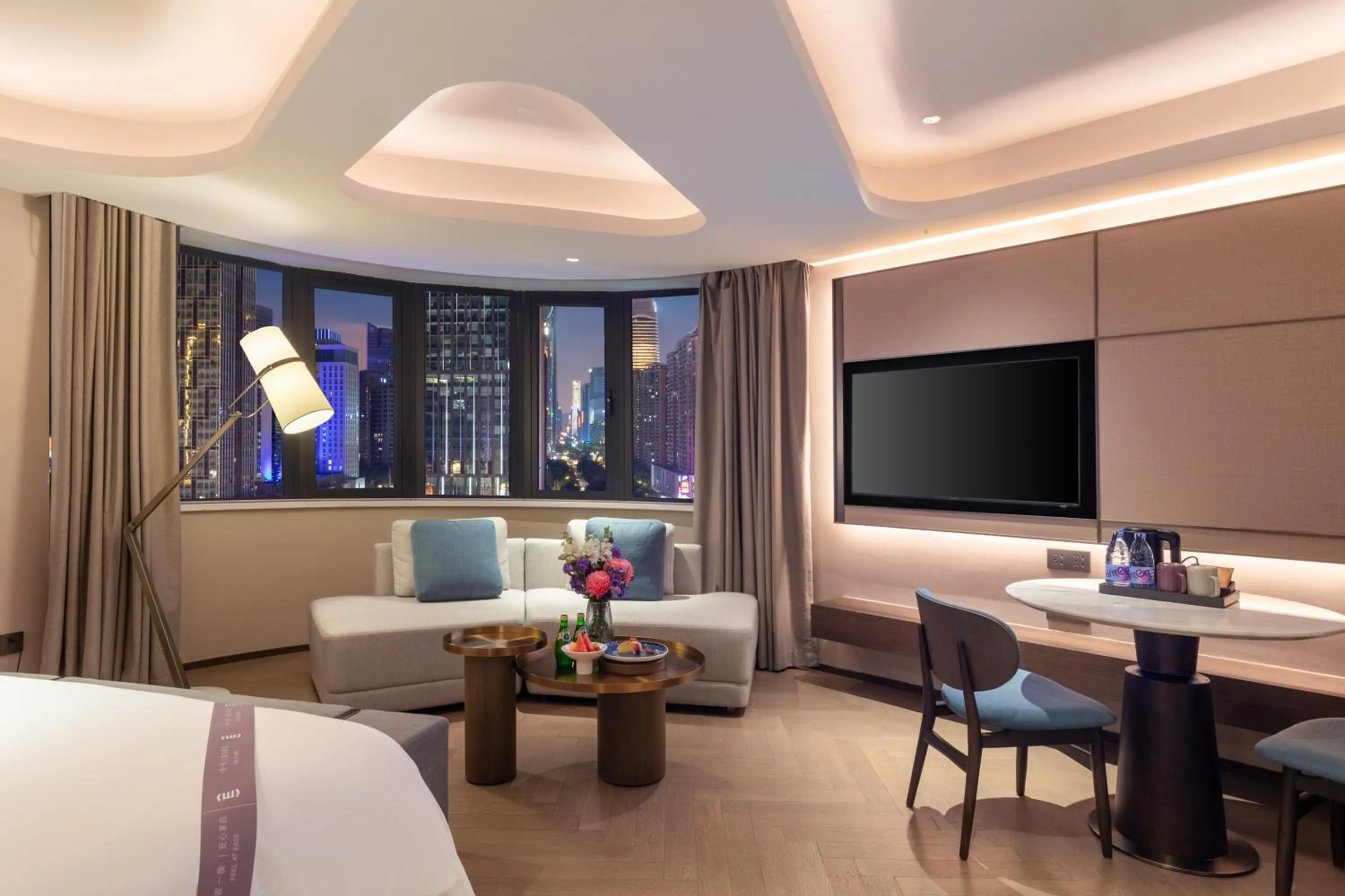 Living room, Bed in Amber East Hotel