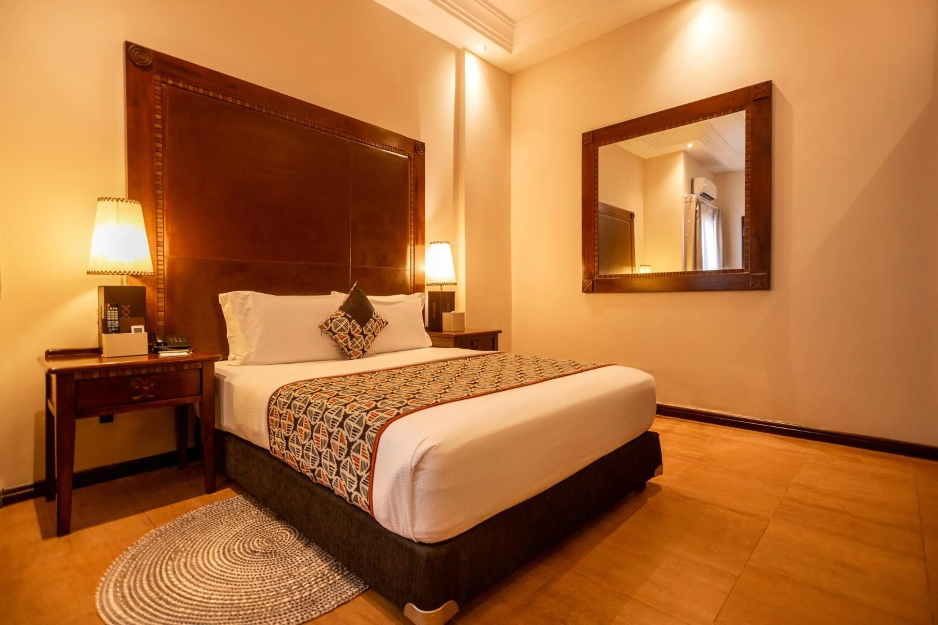 Bed in The African Regent Hotel