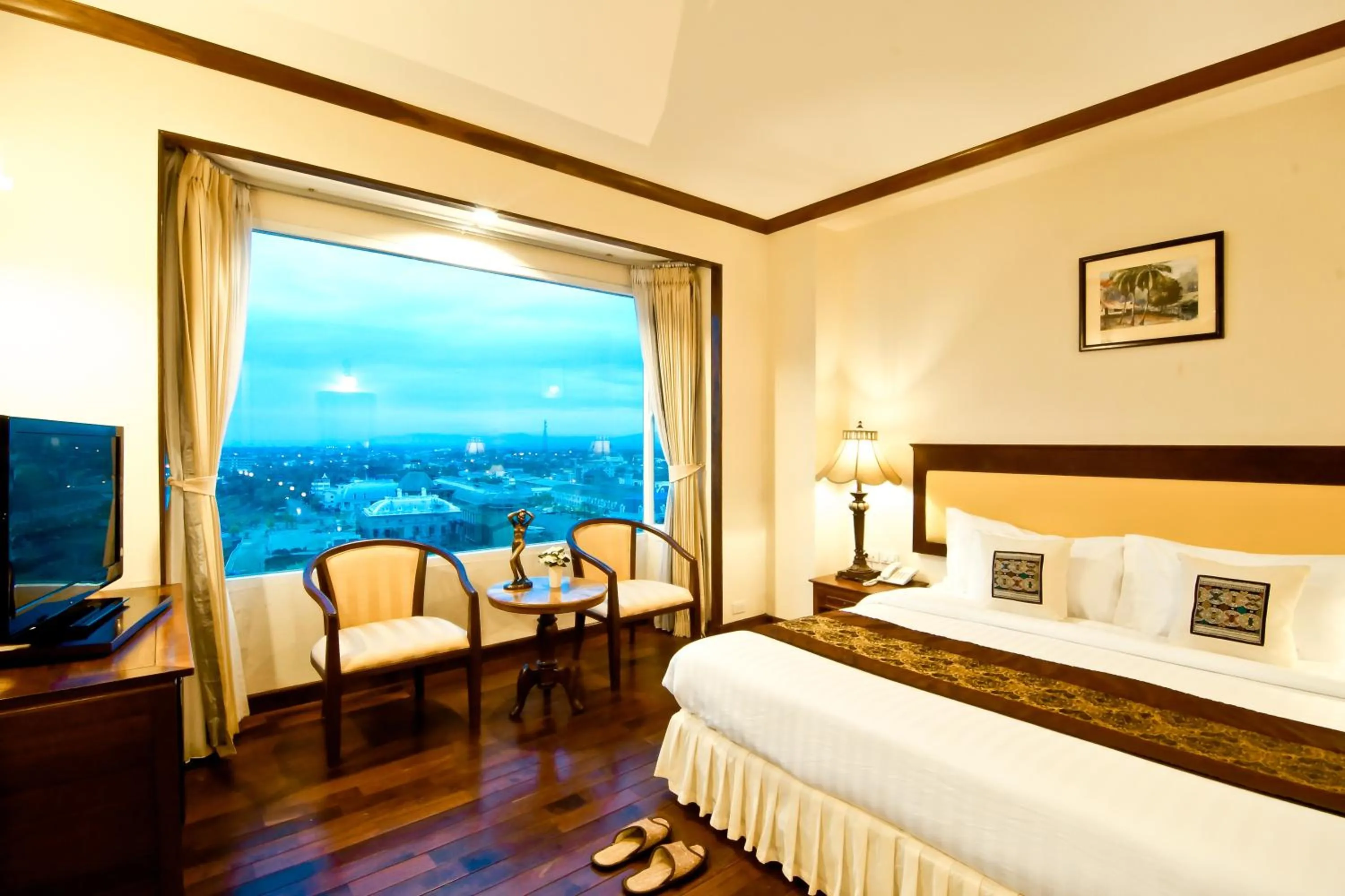 Bed in Champasak Grand Hotel