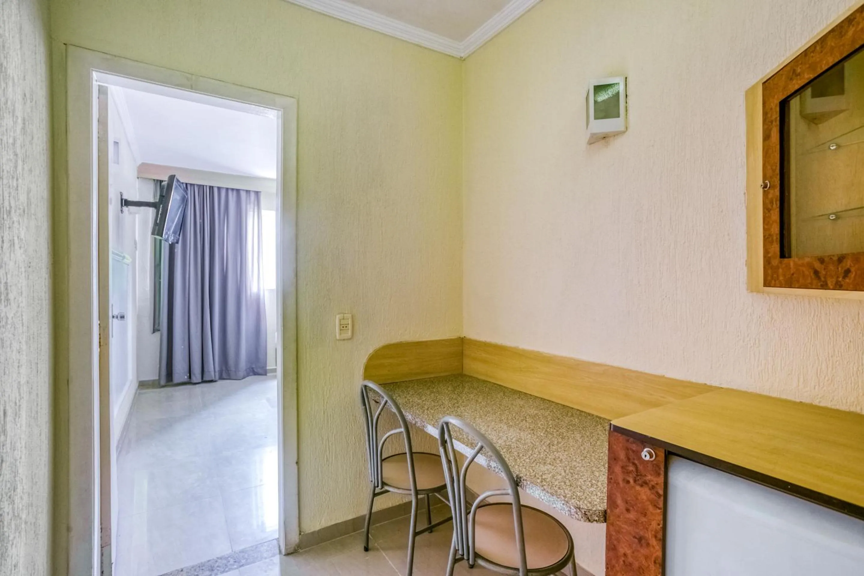 Seating area in OYO Nobs Hotel, São João de Meriti