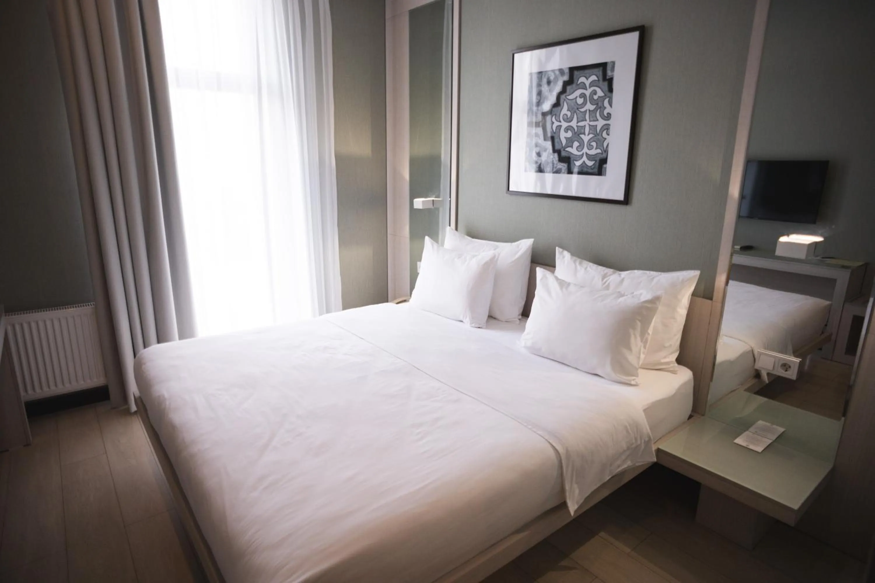 Bed in Resident City Hotel