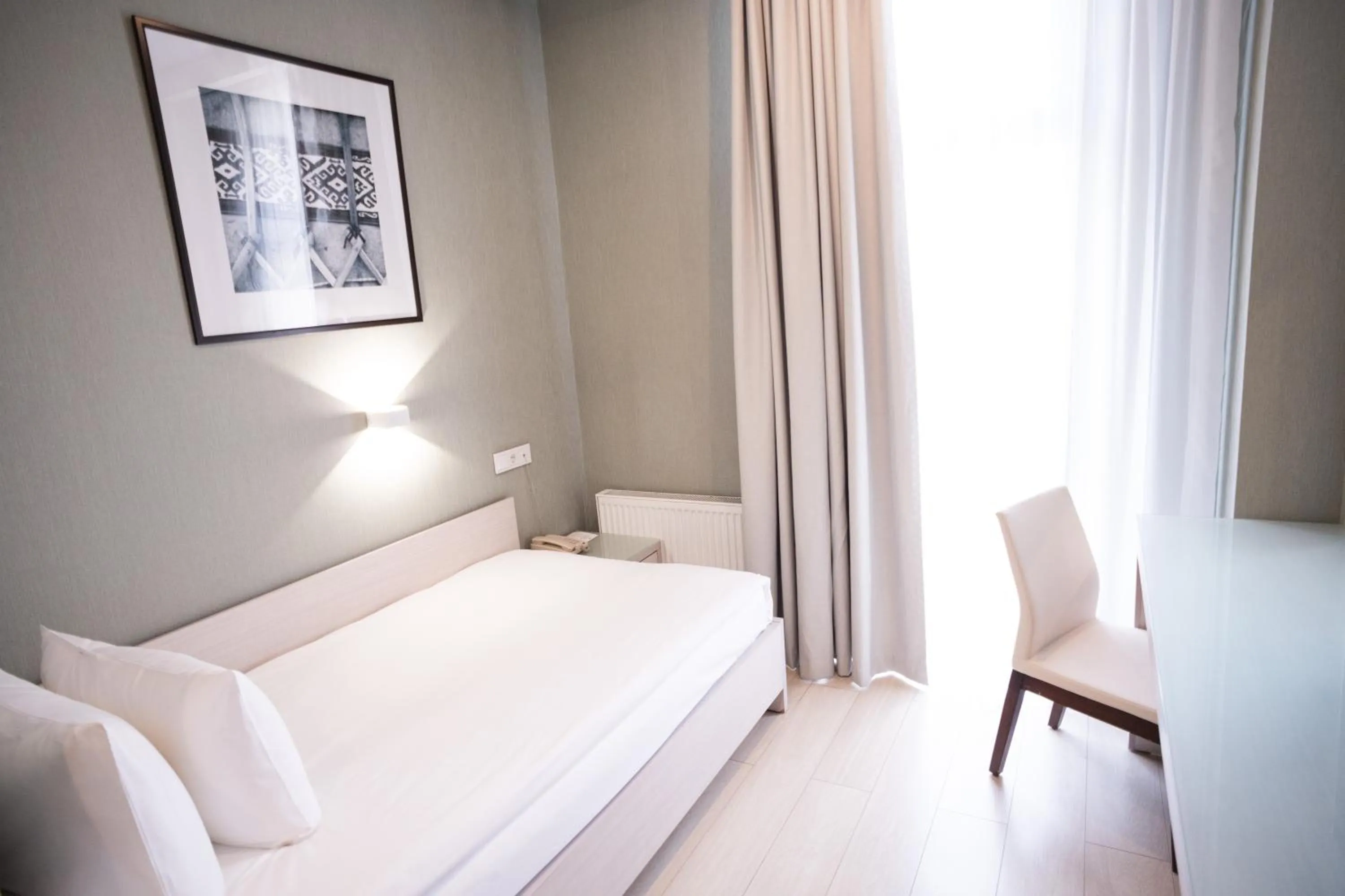 Bed in Resident City Hotel