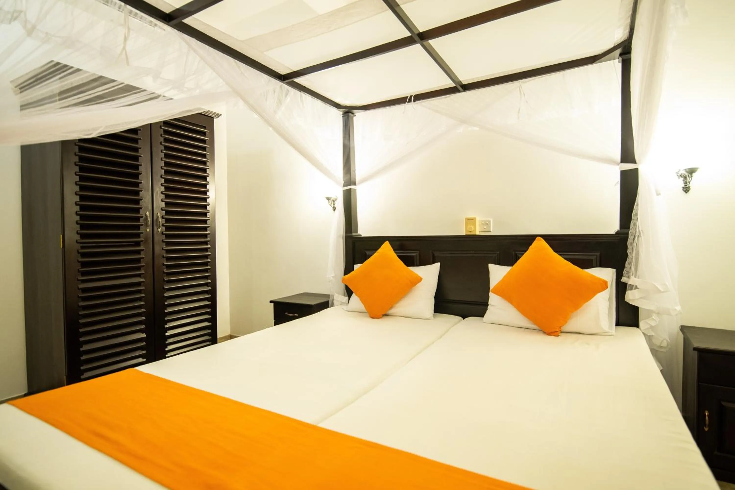 Bed in International Beach Hotel & Restaurant