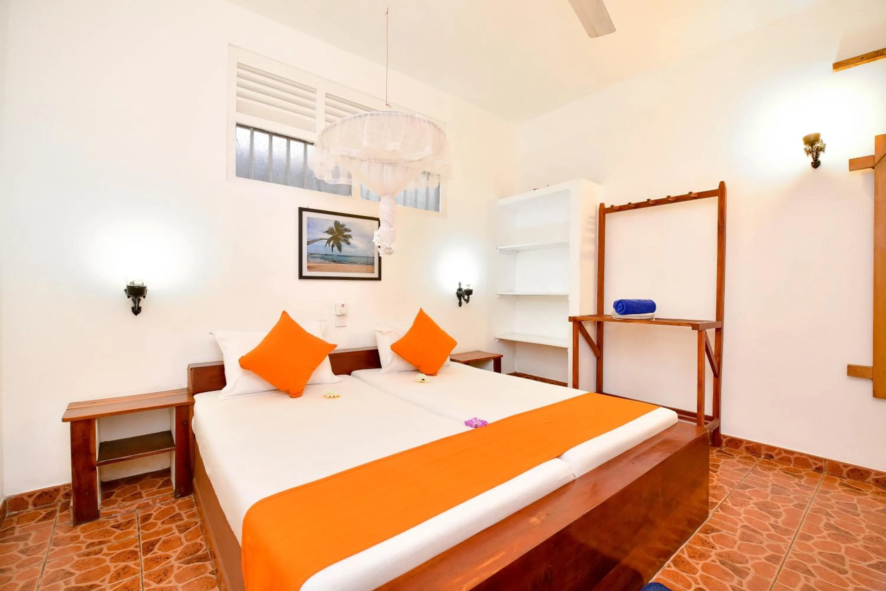 Bed in International Beach Hotel & Restaurant