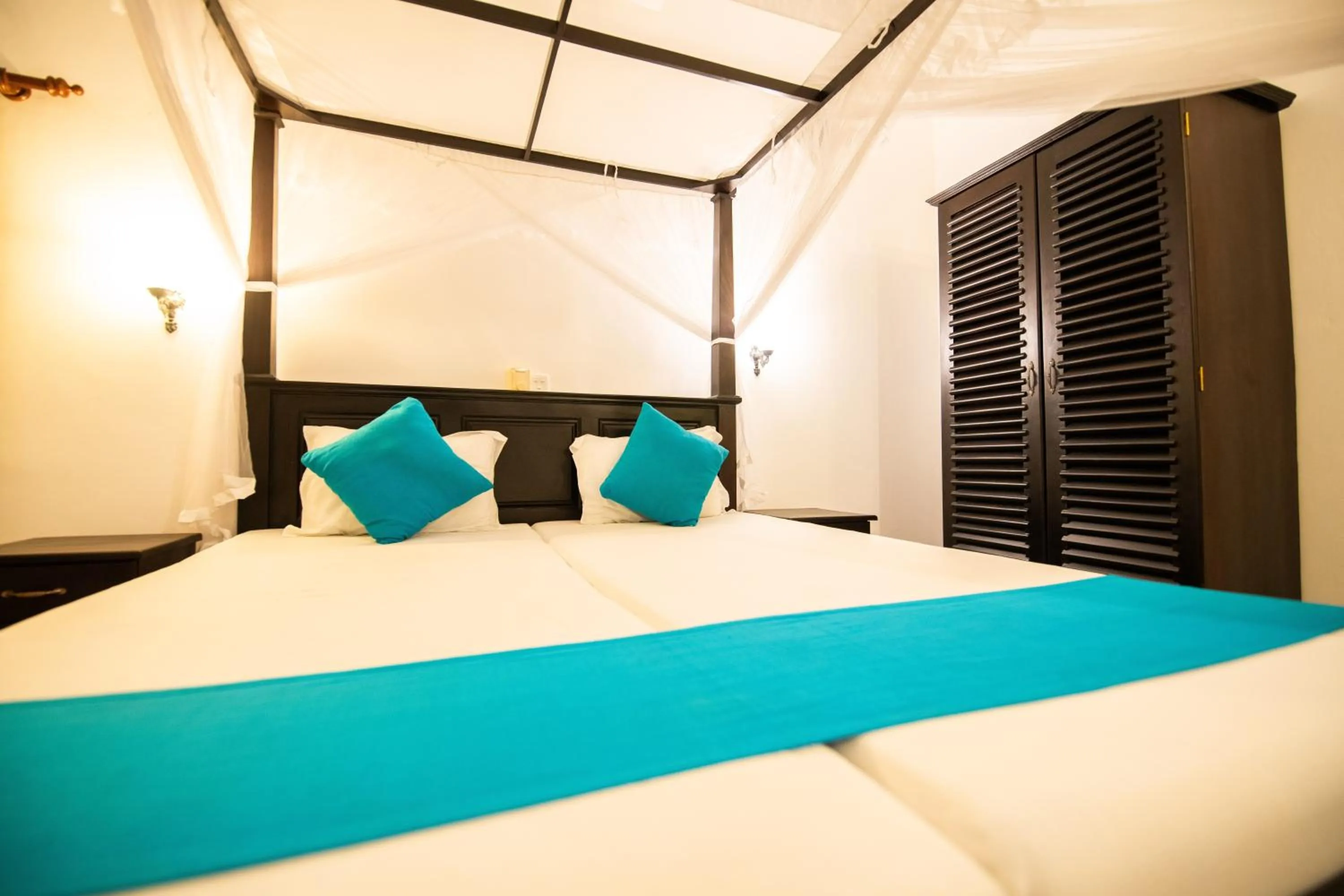 Bed in International Beach Hotel & Restaurant
