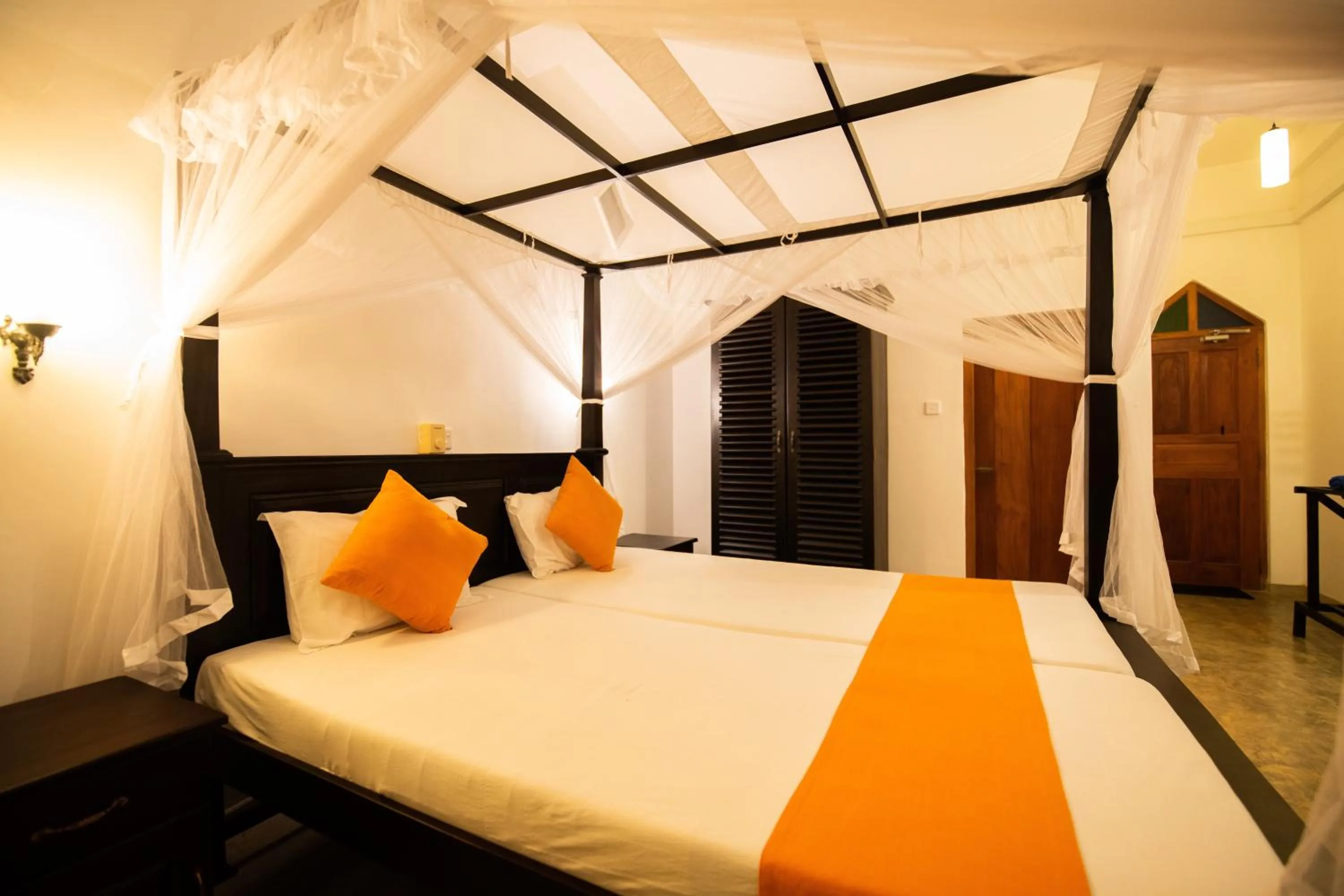 Bed in International Beach Hotel & Restaurant