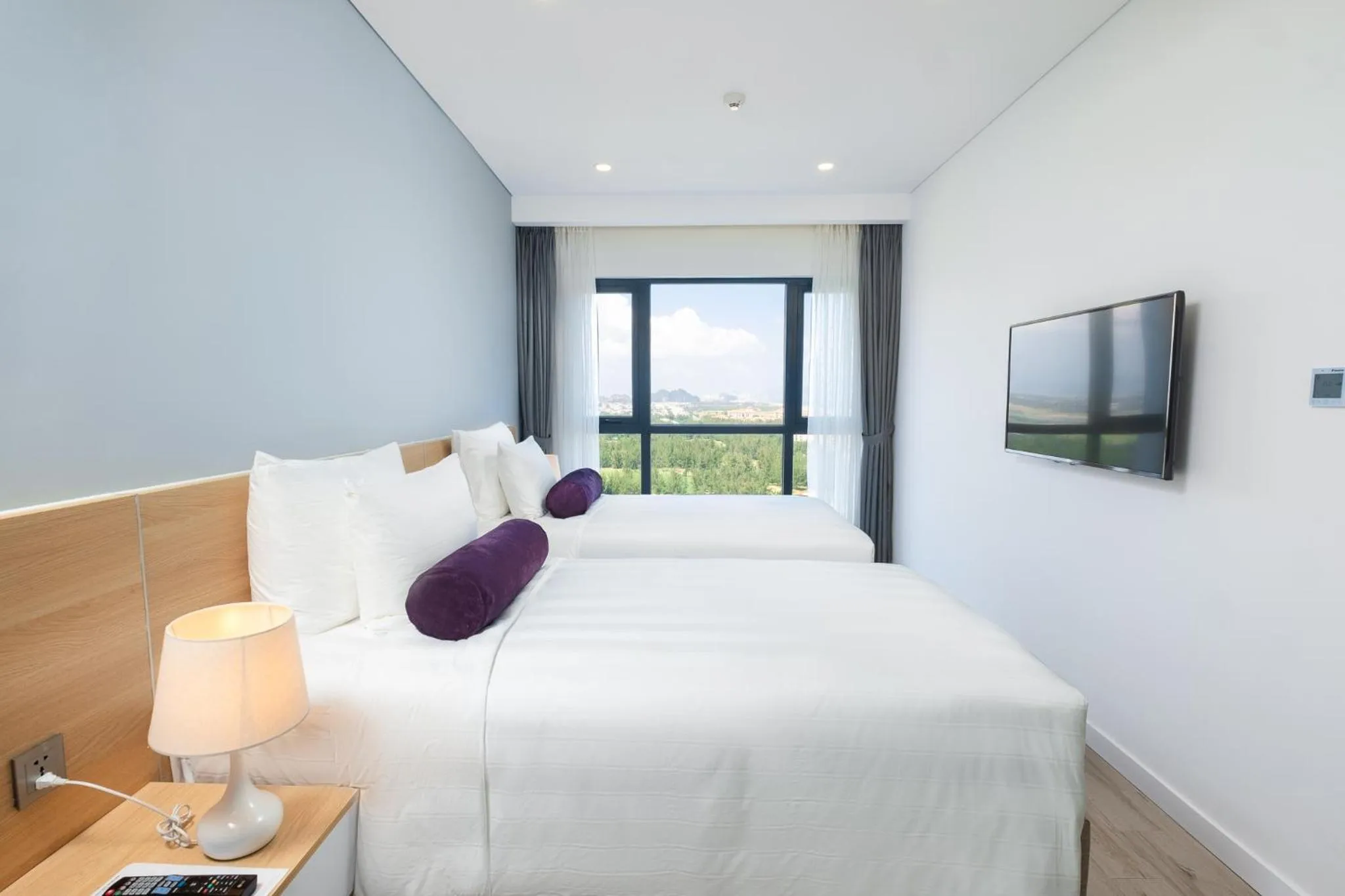 Bed in Carinae Danang Hotel