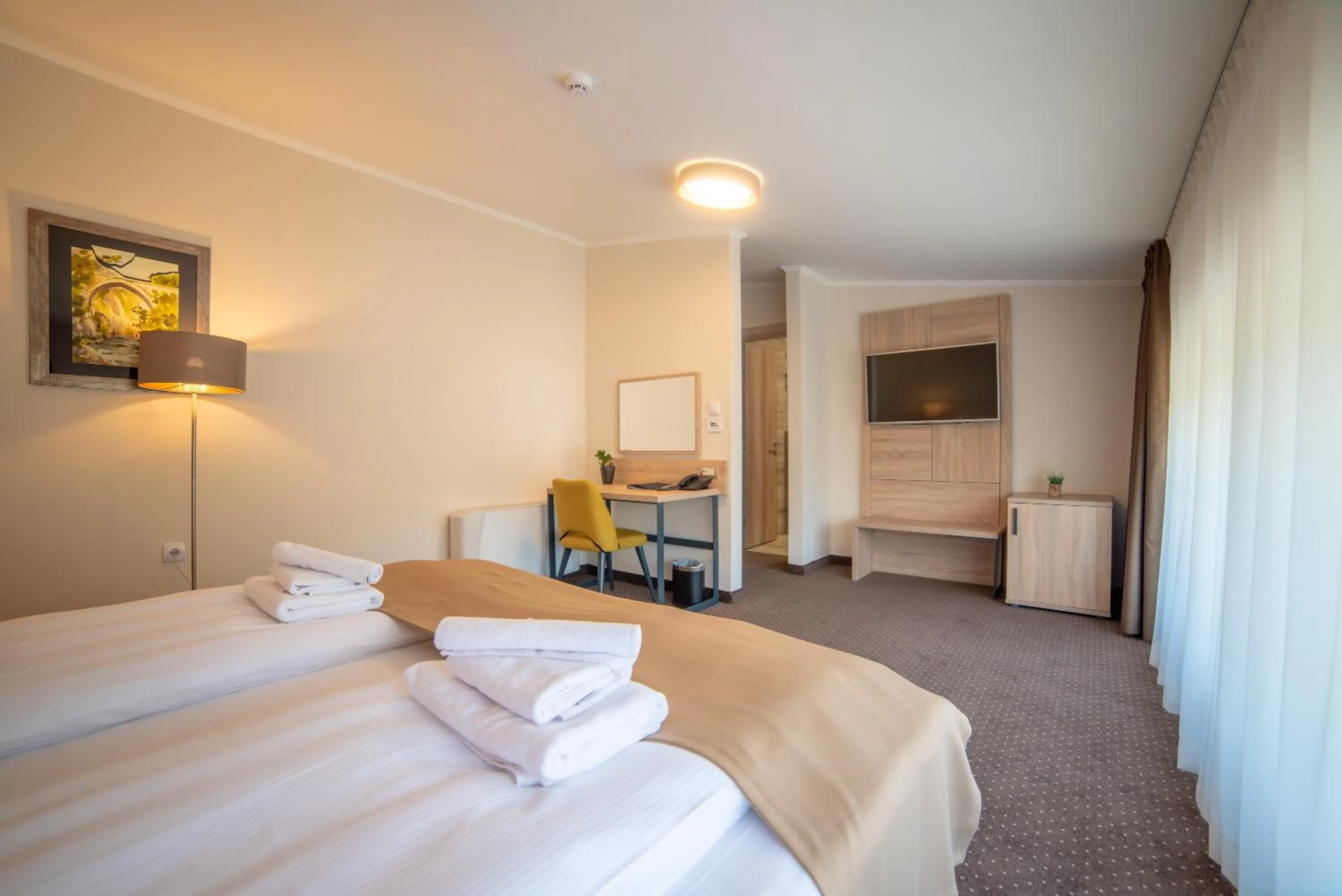 Bed in Hotel Soni Lux