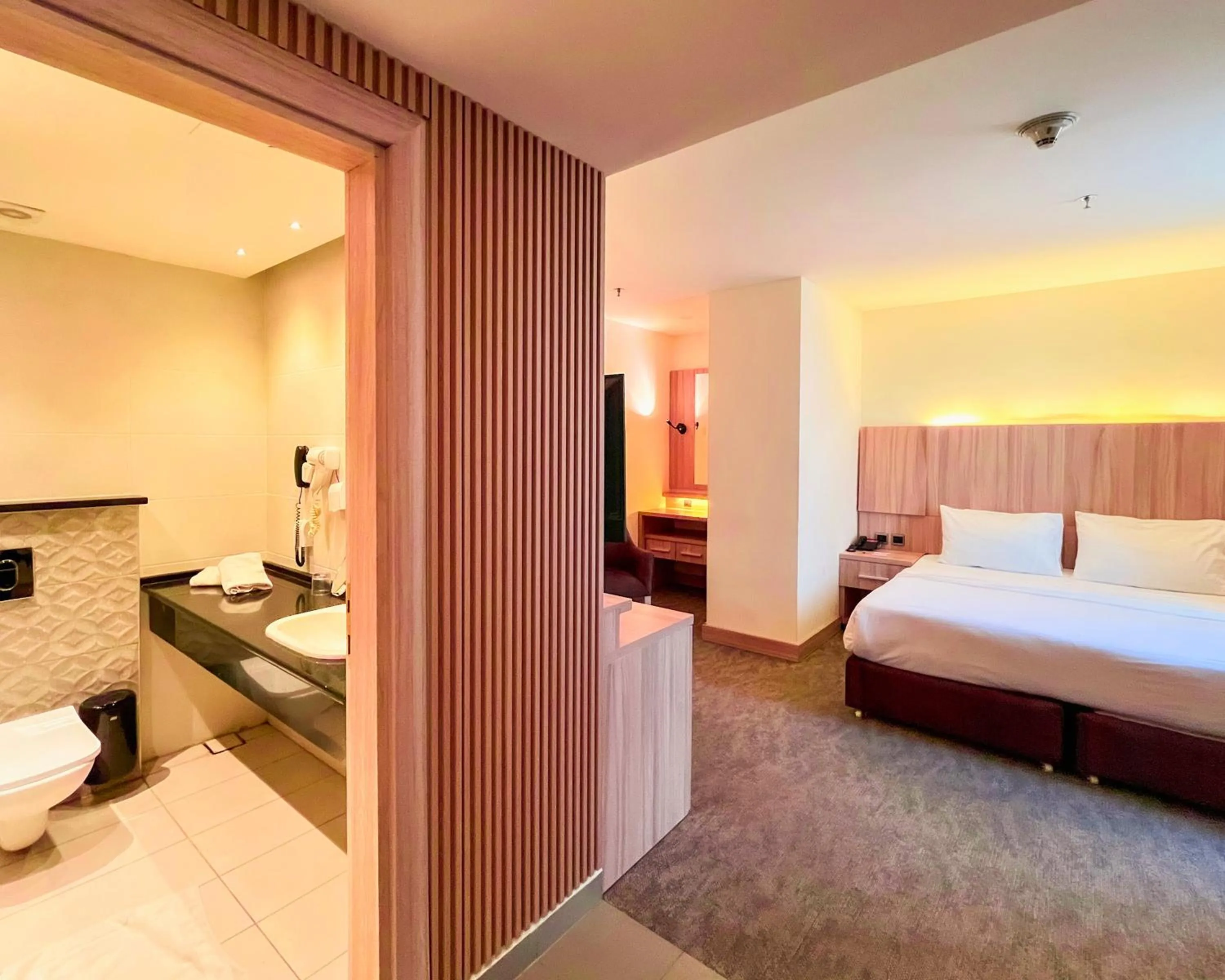 Photo of the whole room, Bed in La Casa Hotel Amman by FHM