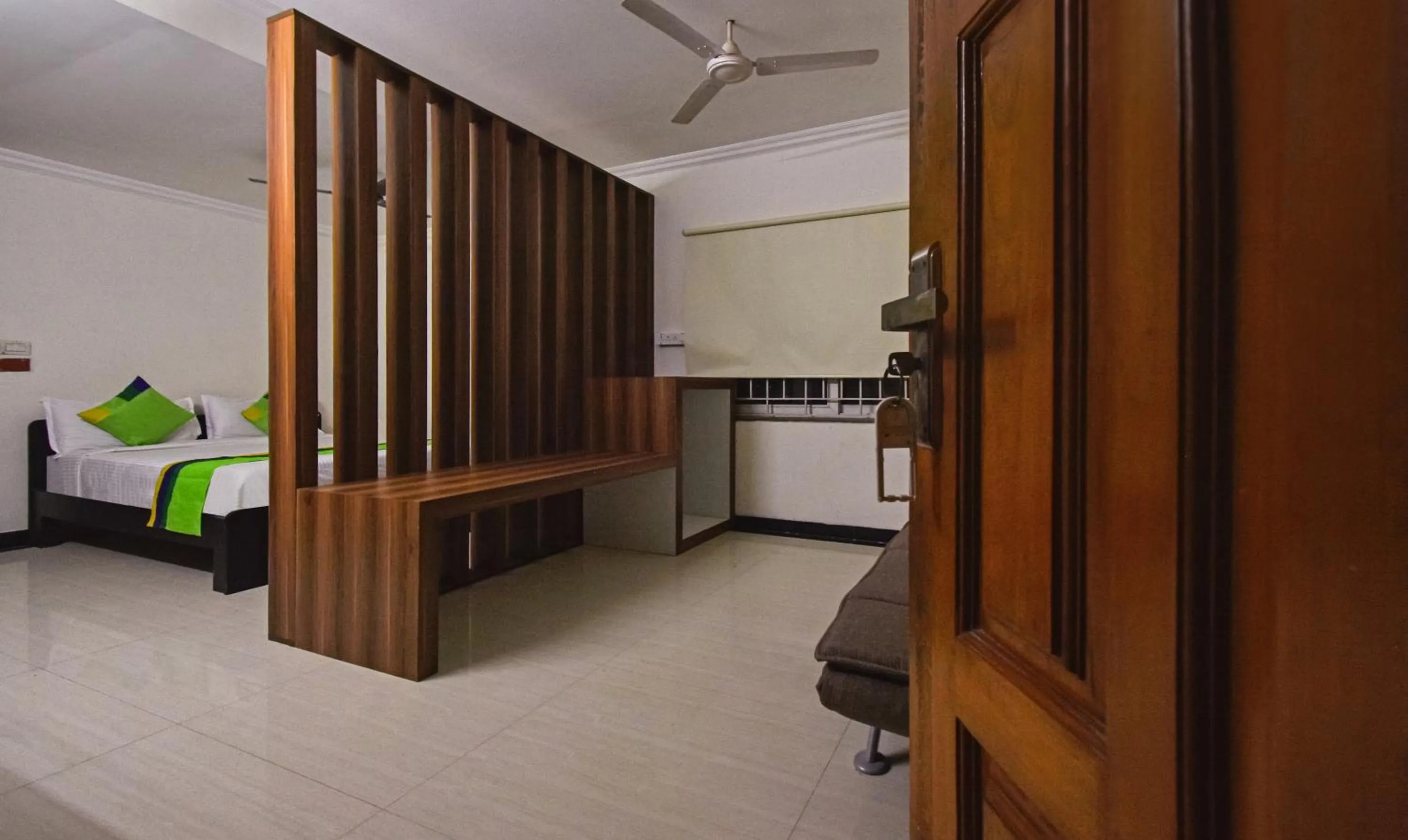 Seating area, Bed in Treebo Samhaar Residency Thoraipakkam