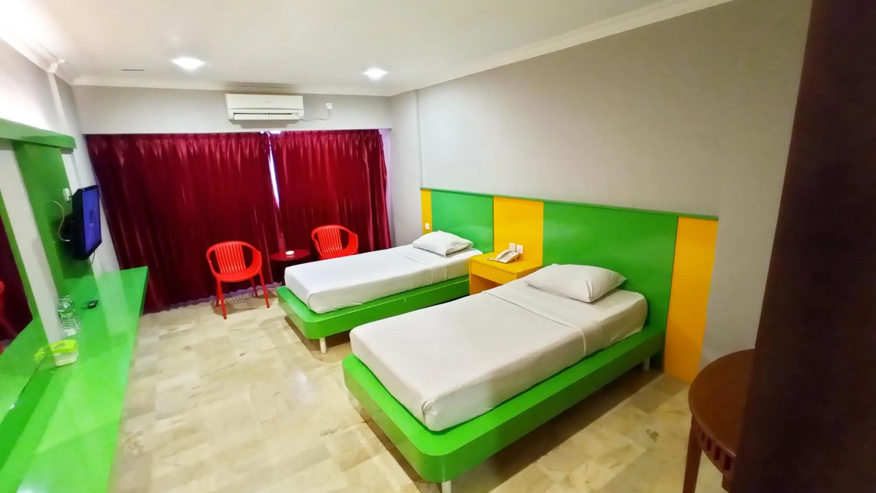 Bed in Kita Hotel