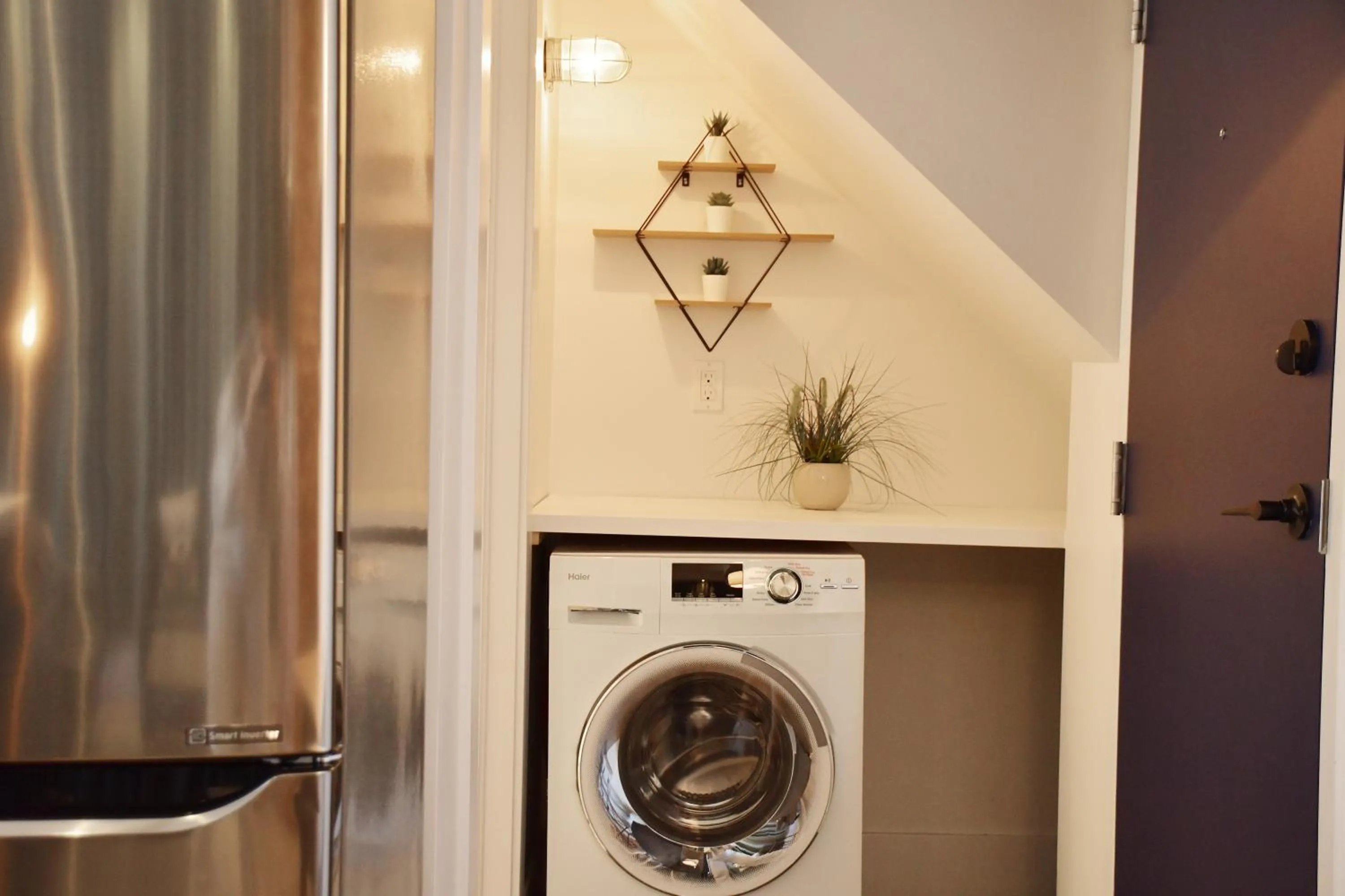 washing machine in Maison Évangéline by Bower Boutique Hotels