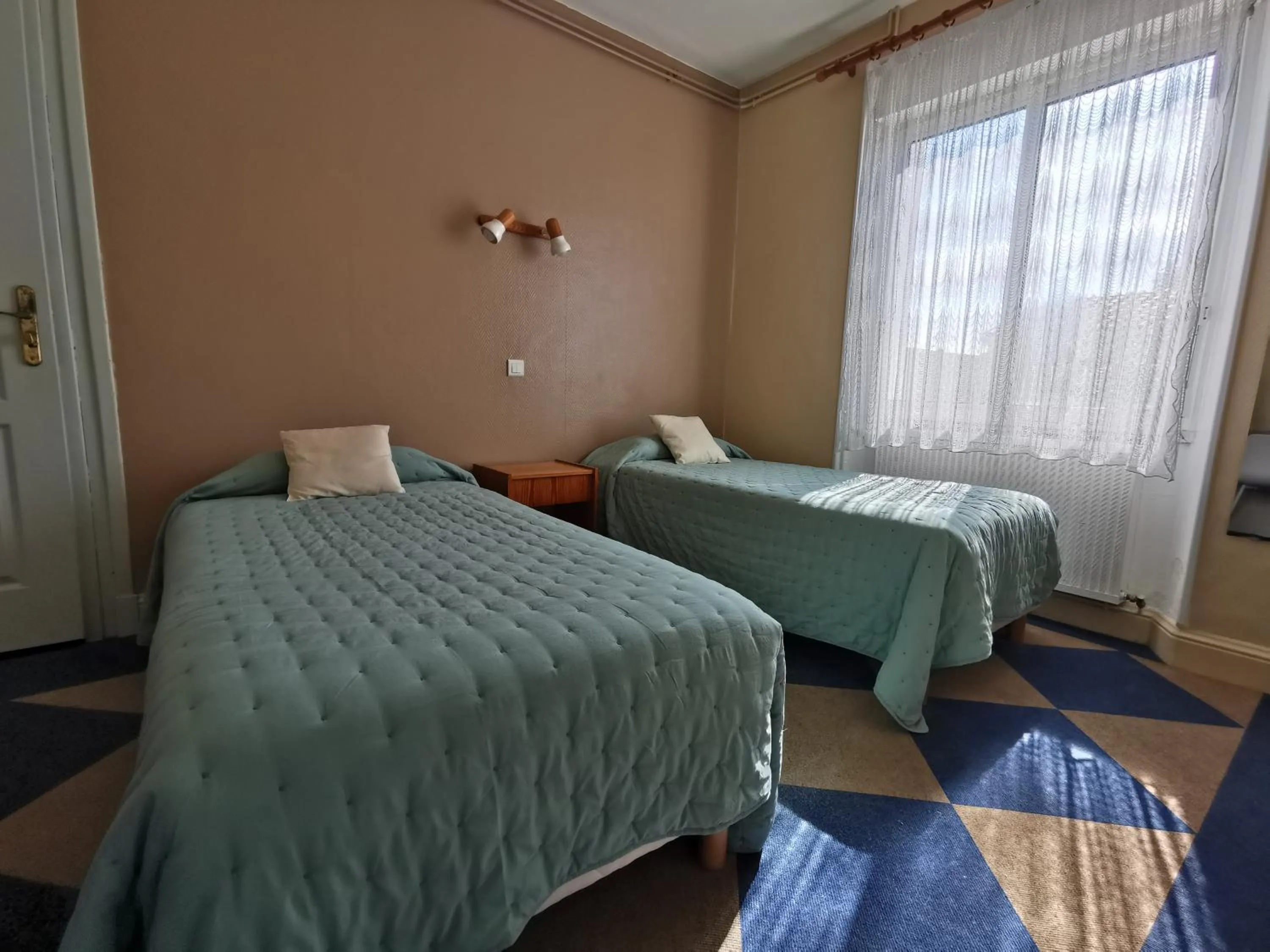 Bed in Hotel le Pasteur