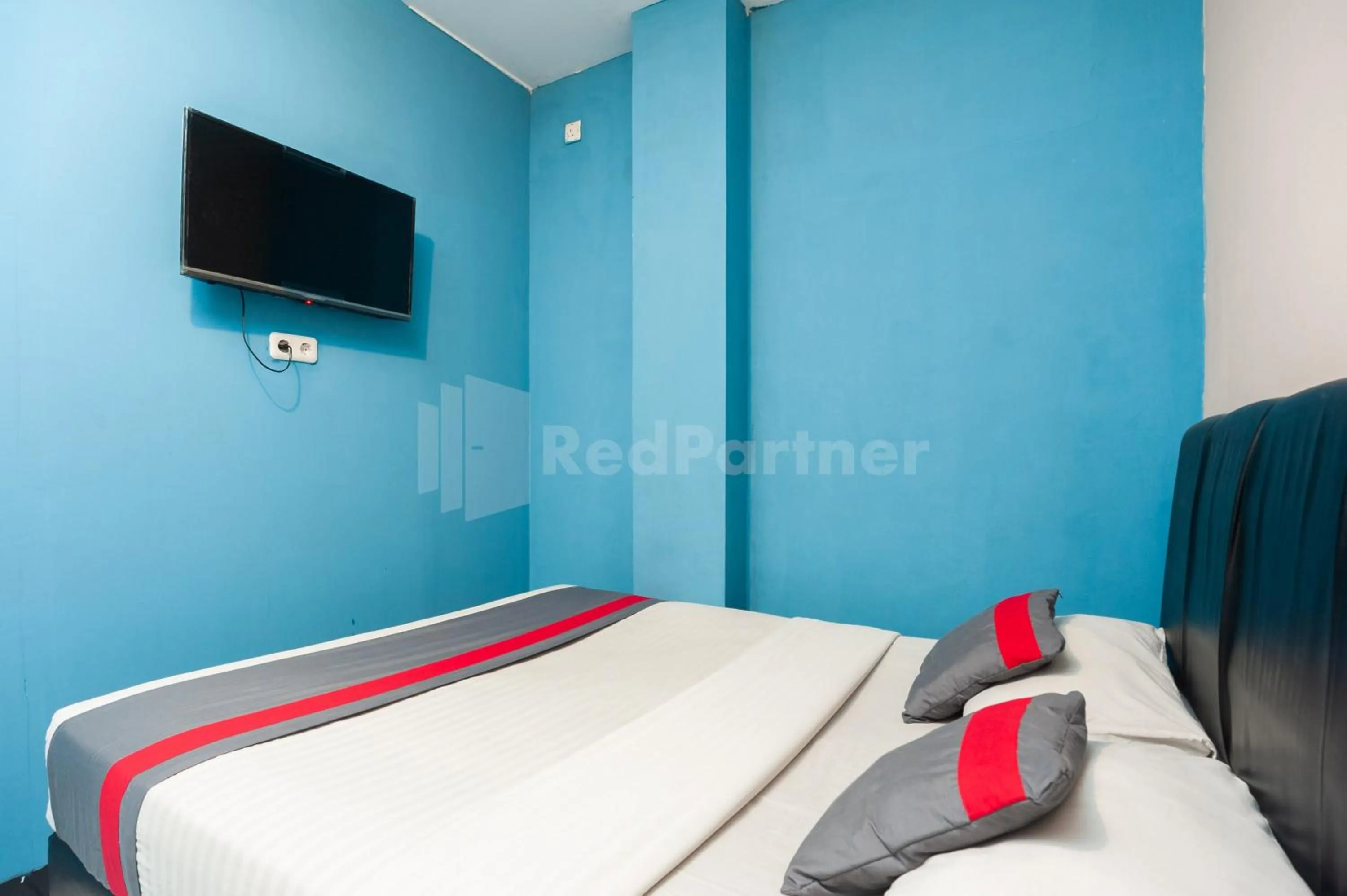 Bed in J&B Rooms Pramuka Jakarta Mitra RedDoorz