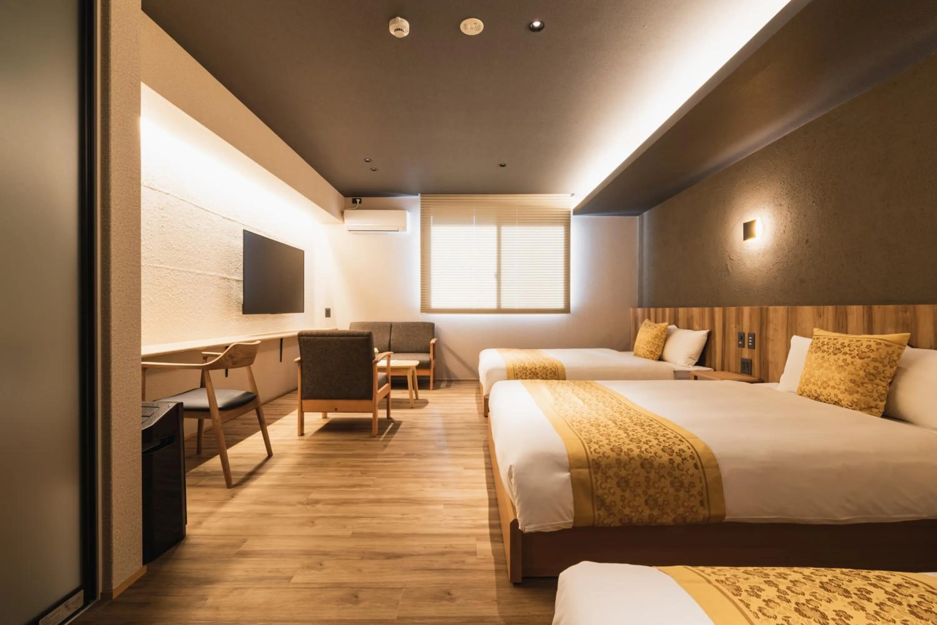 Photo of the whole room, Bed in GRAND BASE Beppu Ekihigashi