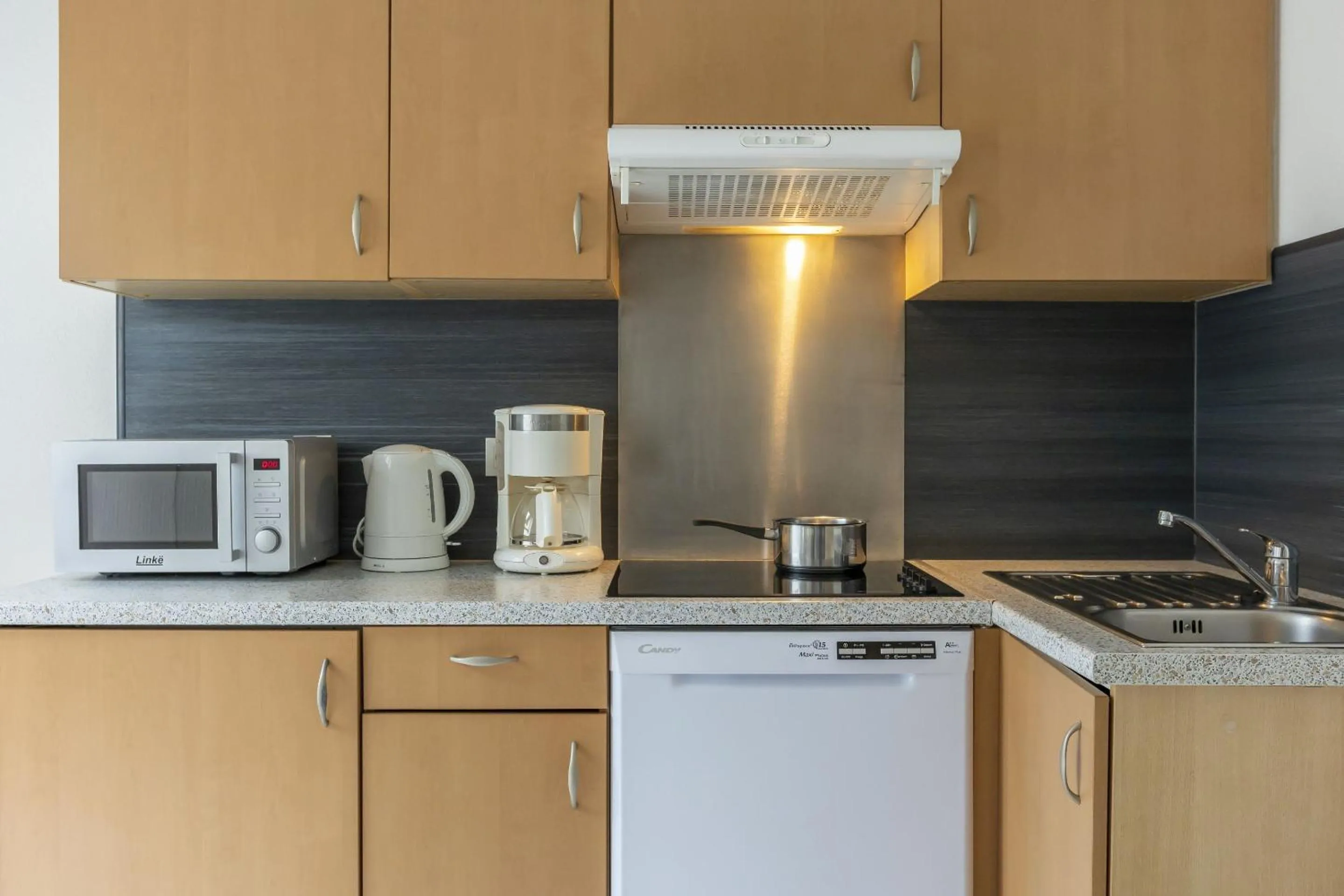 Kitchen or kitchenette in Résidence Odalys Le Domaine des Rois