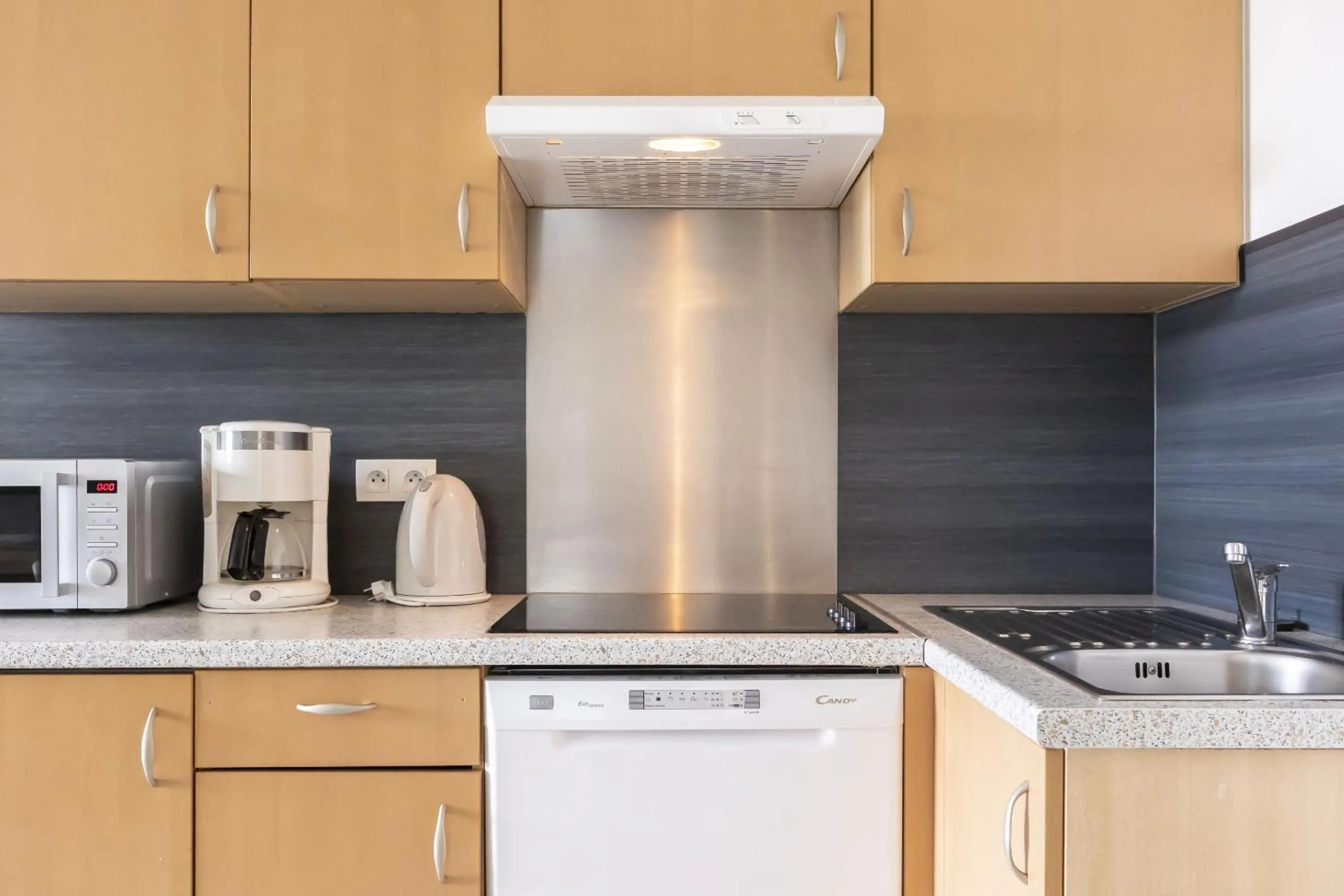 Kitchen or kitchenette in Résidence Odalys Le Domaine des Rois