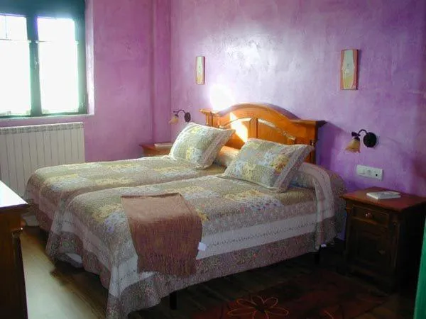 Bed in Hostería Casa Flor